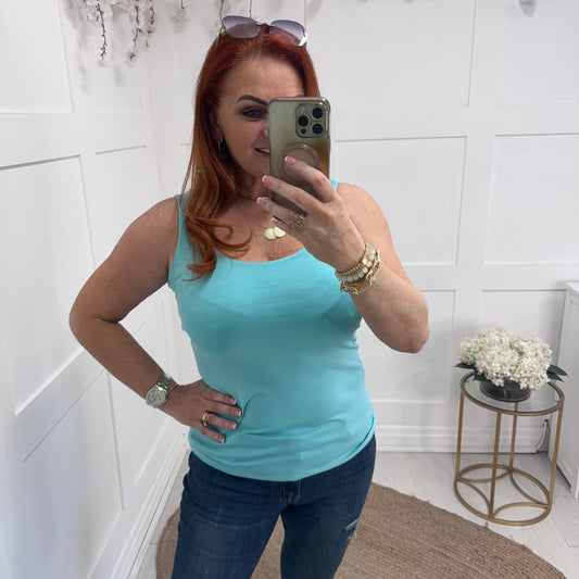 Abigail: Stretchy aqua basic vest top. 2 sizes