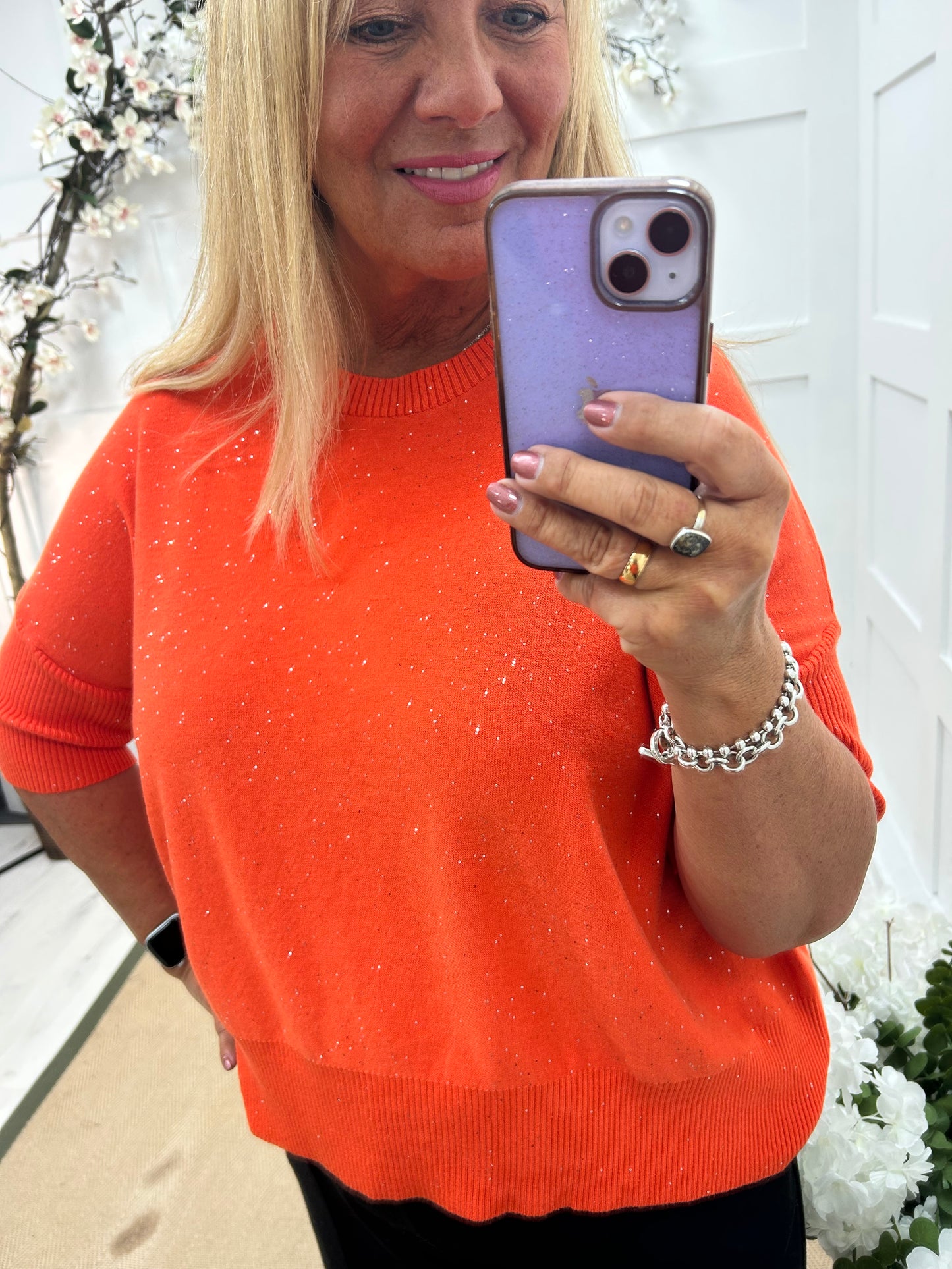 Josie: Orange short sleeve sparkle top. One Sz: 12-18