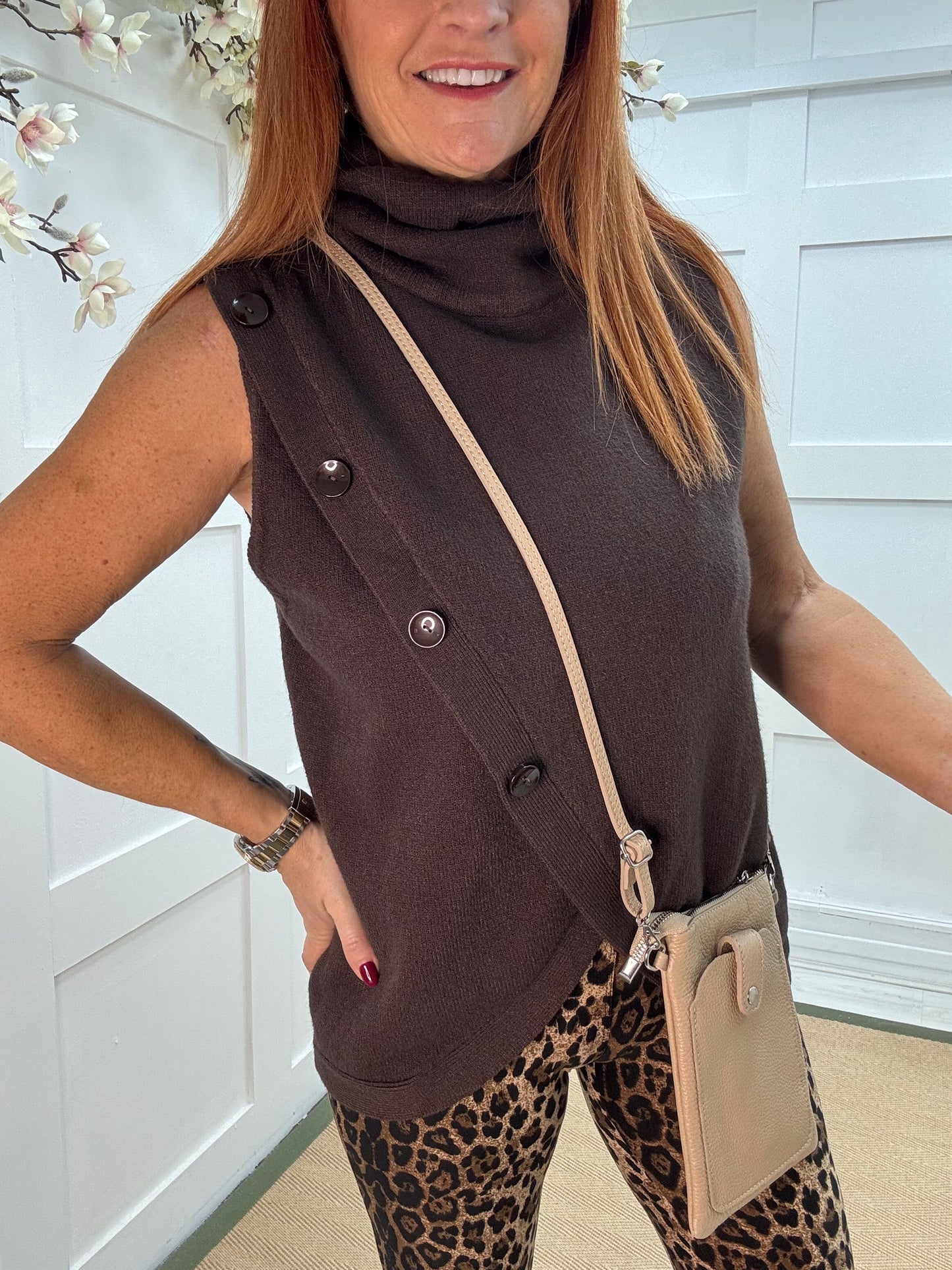 Viola: Brown sleeveless cowl neck wrap top. One Sz: 10-16