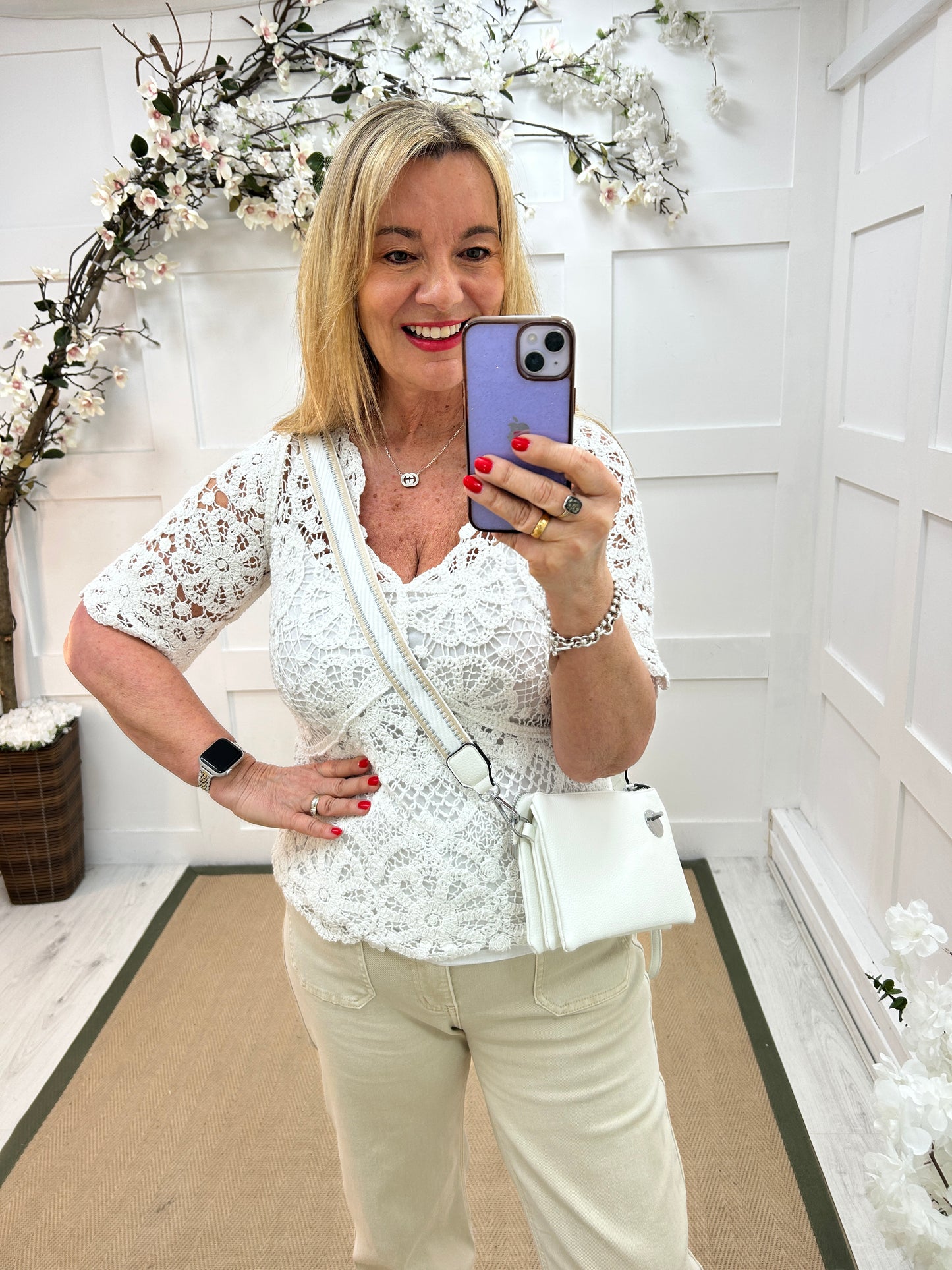 Ellie: White V neck short sleeved floral crochet top. One size: 10-16