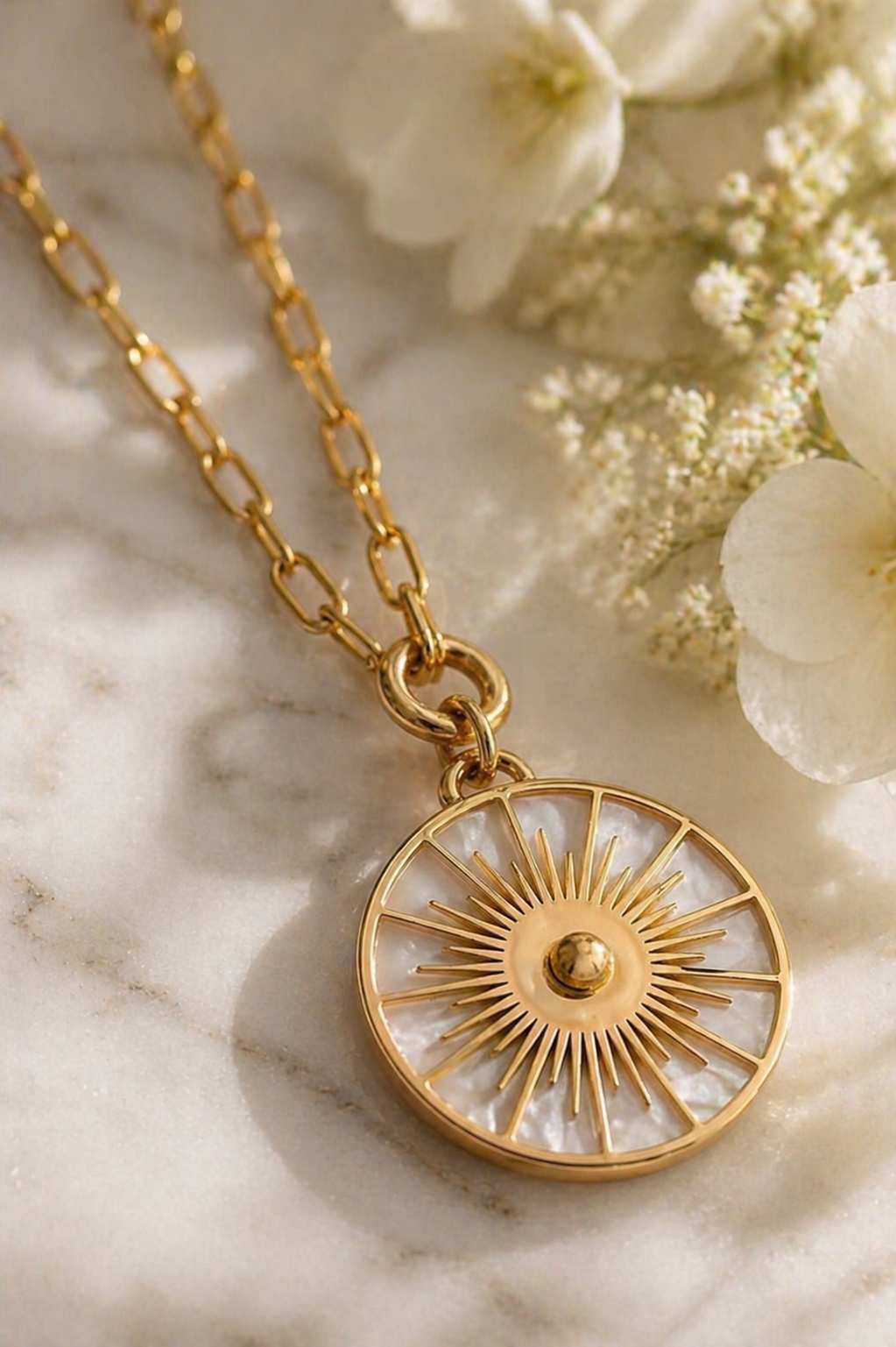 Solique: Gold mother of pearl sundial necklace