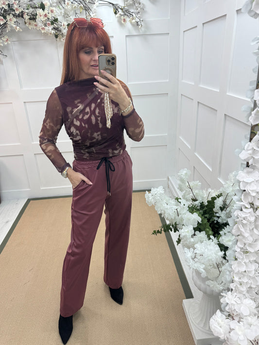 Quinn: Burgundy faux leather trousers. One size: 10-14