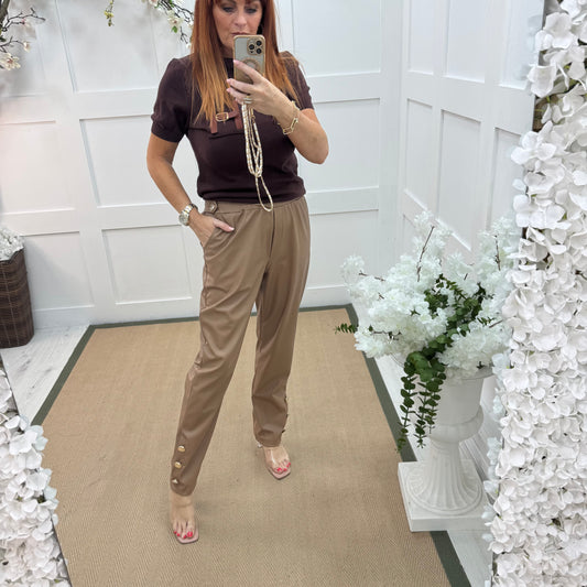 Tatum: Coffee faux leather button trousers. One size: 14-18