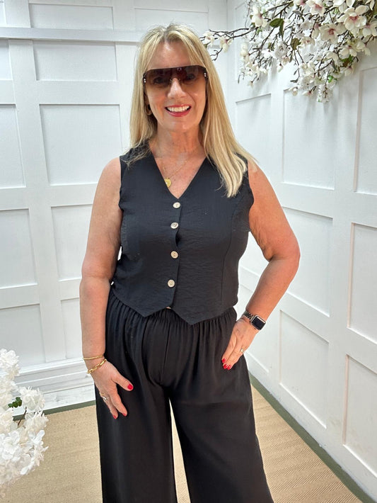 Cody: Black waistcoat two piece trouser set. One size: 12-16