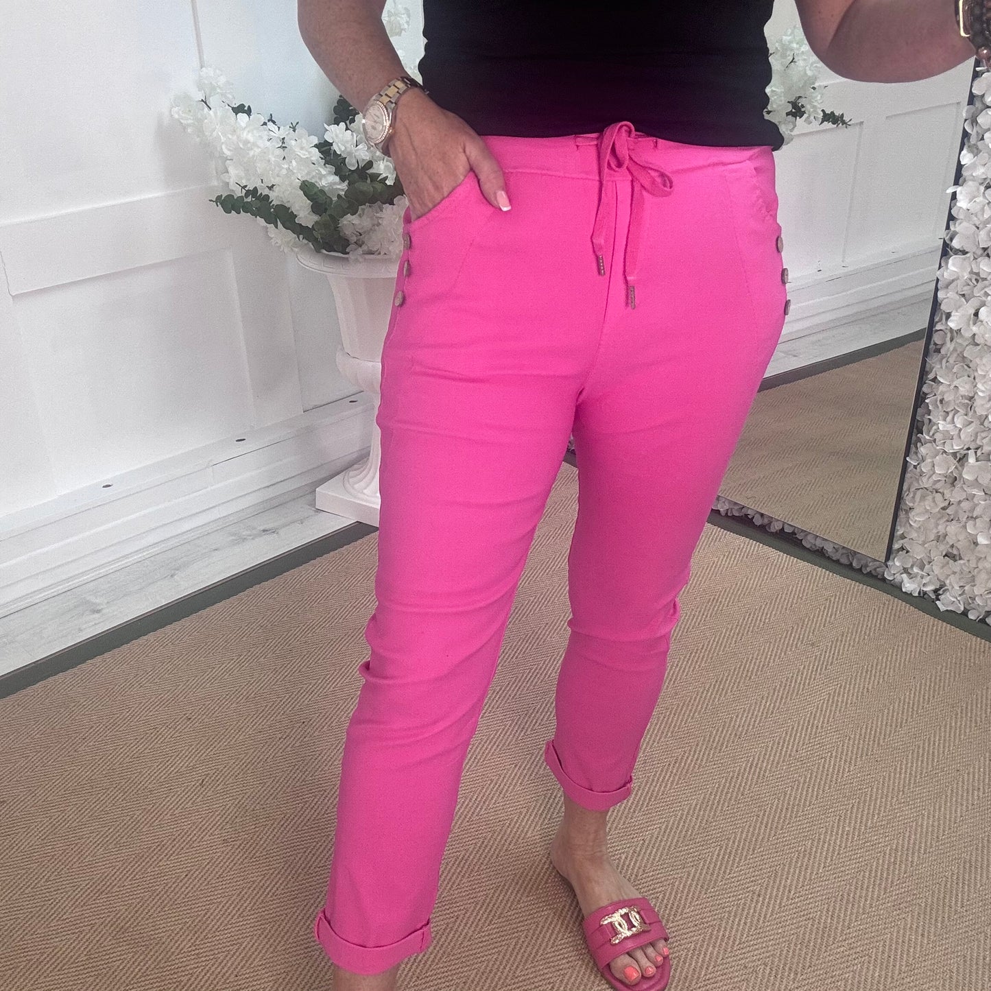 Betsy: Stretchy hot pink button magic trousers. One size: 10-14