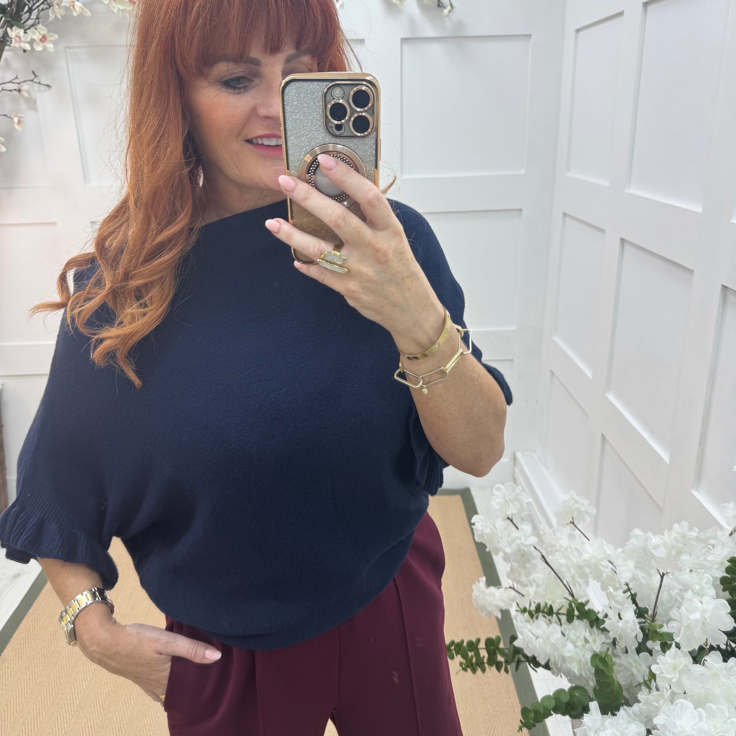 Sierra: Navy batwing fluted sleeve knitted top. One Size 12-18/20