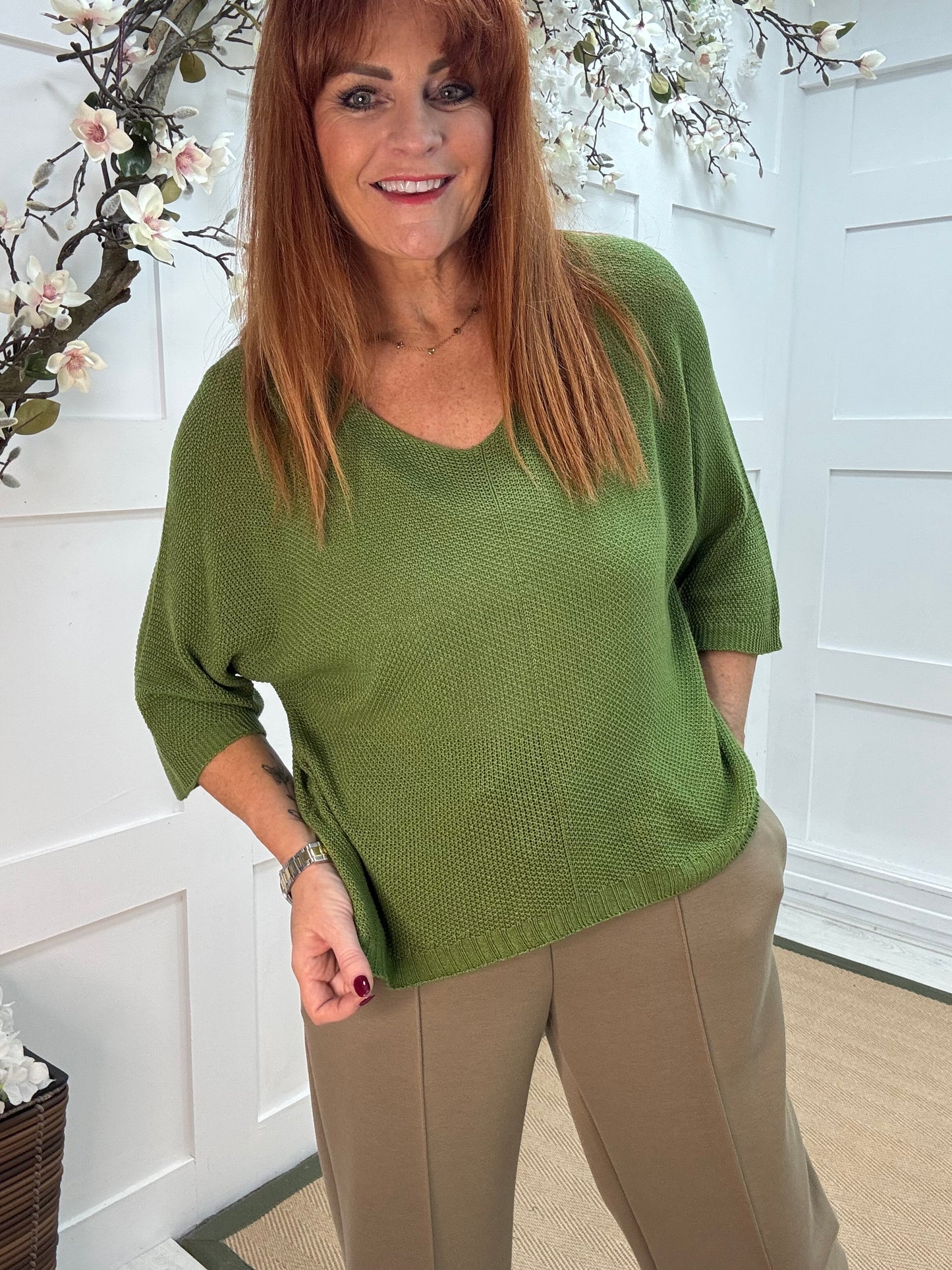 Nina: Green V neck fine knit top. One size: 10-16