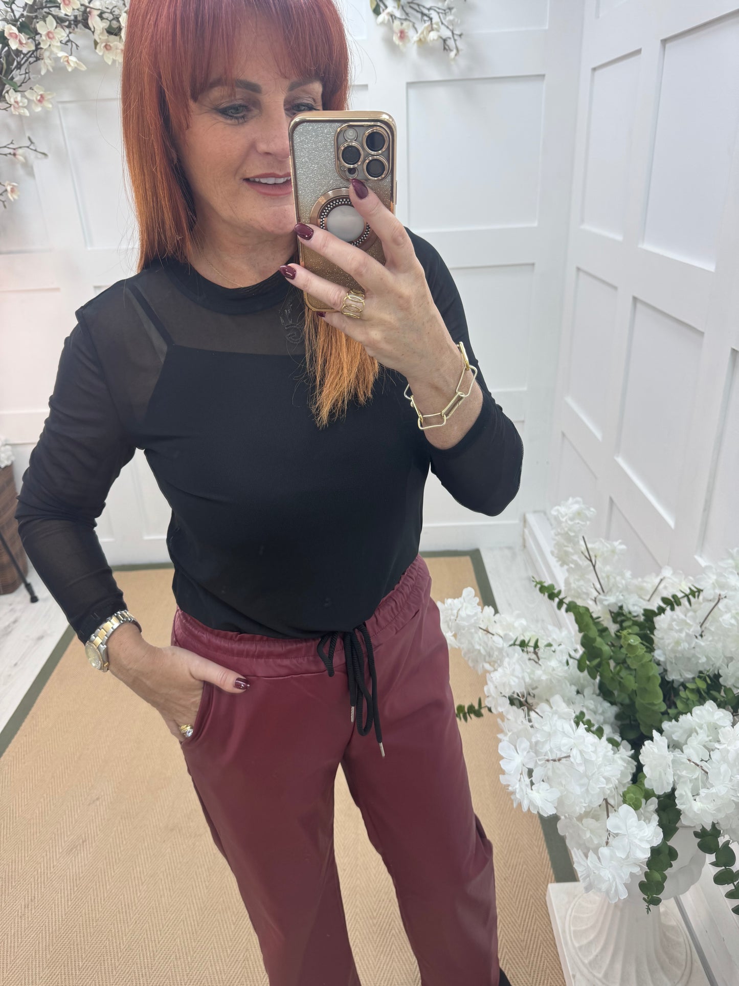 Romy: Black stretchy sheer mesh top. One size 12-18