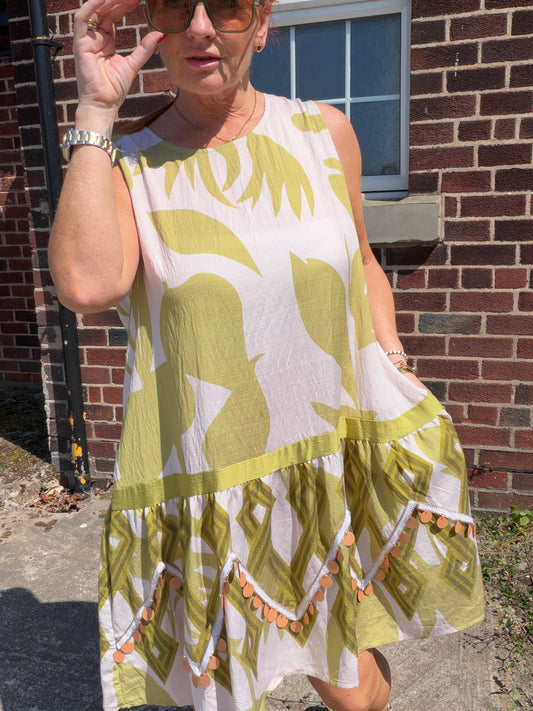 Molly: Leaf printed midi dress with large disc detail. One size: 12-18. 2 colours