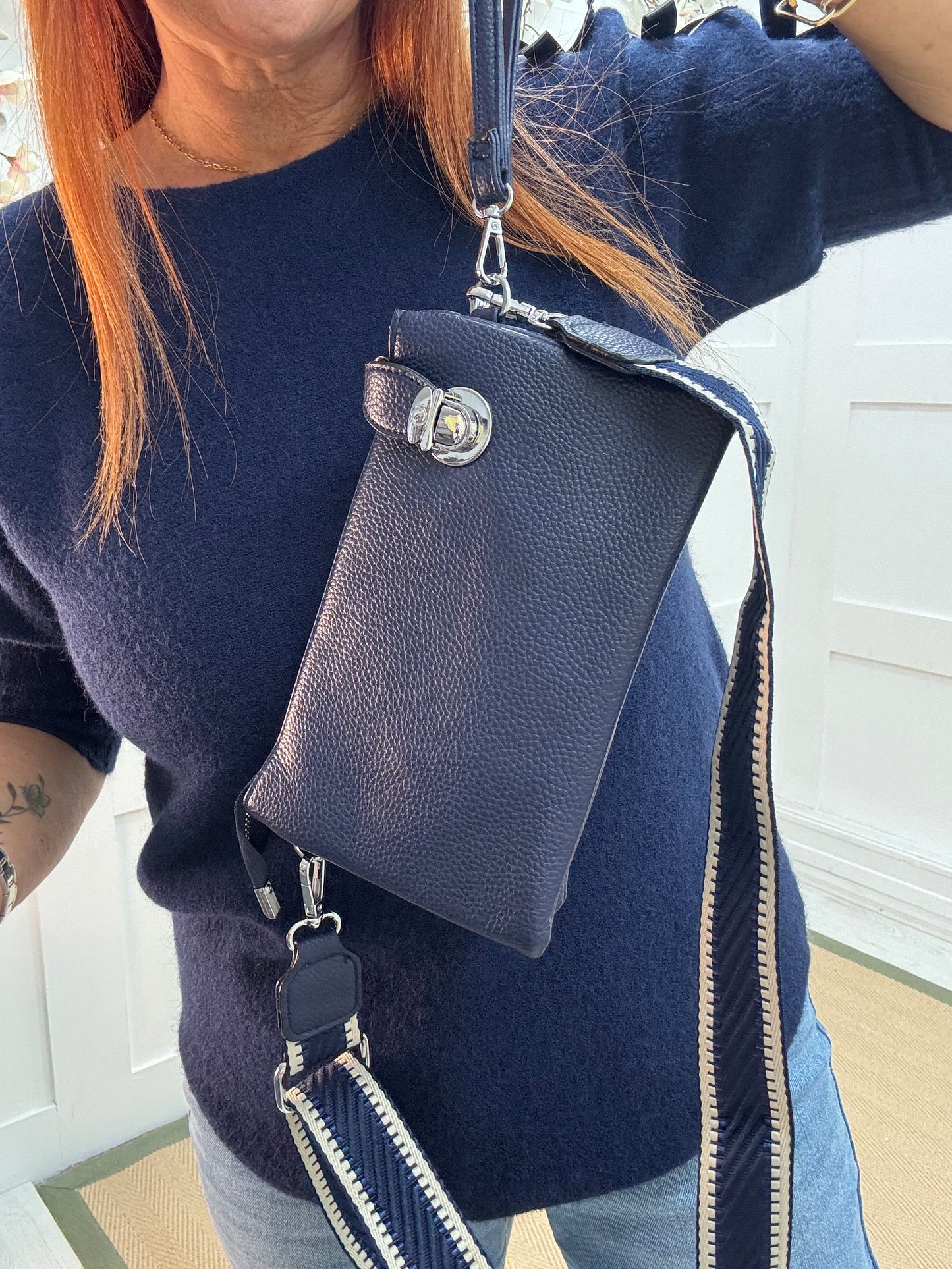 Britt: Navy three pocket crossbody bag.