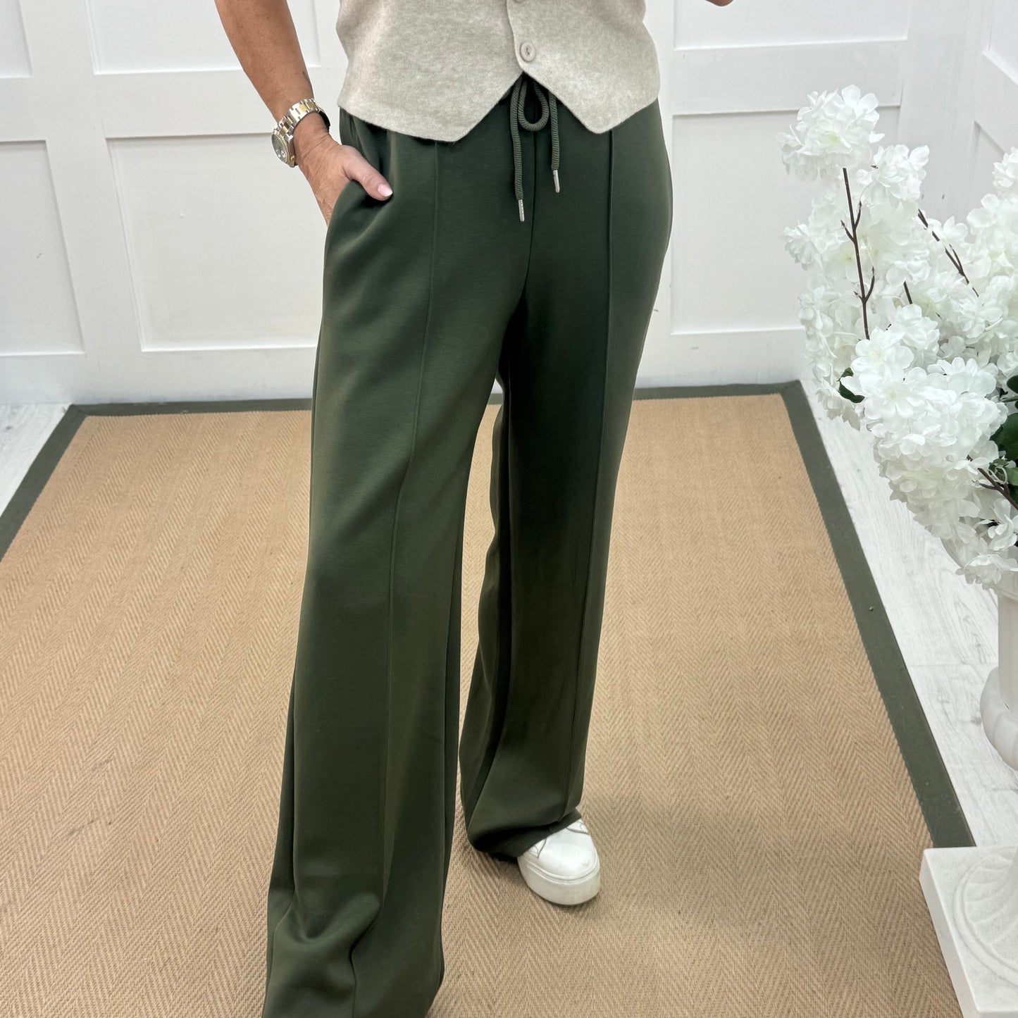 Trudy: Khaki stretchy wide leg pocket trousers. 2 sizes