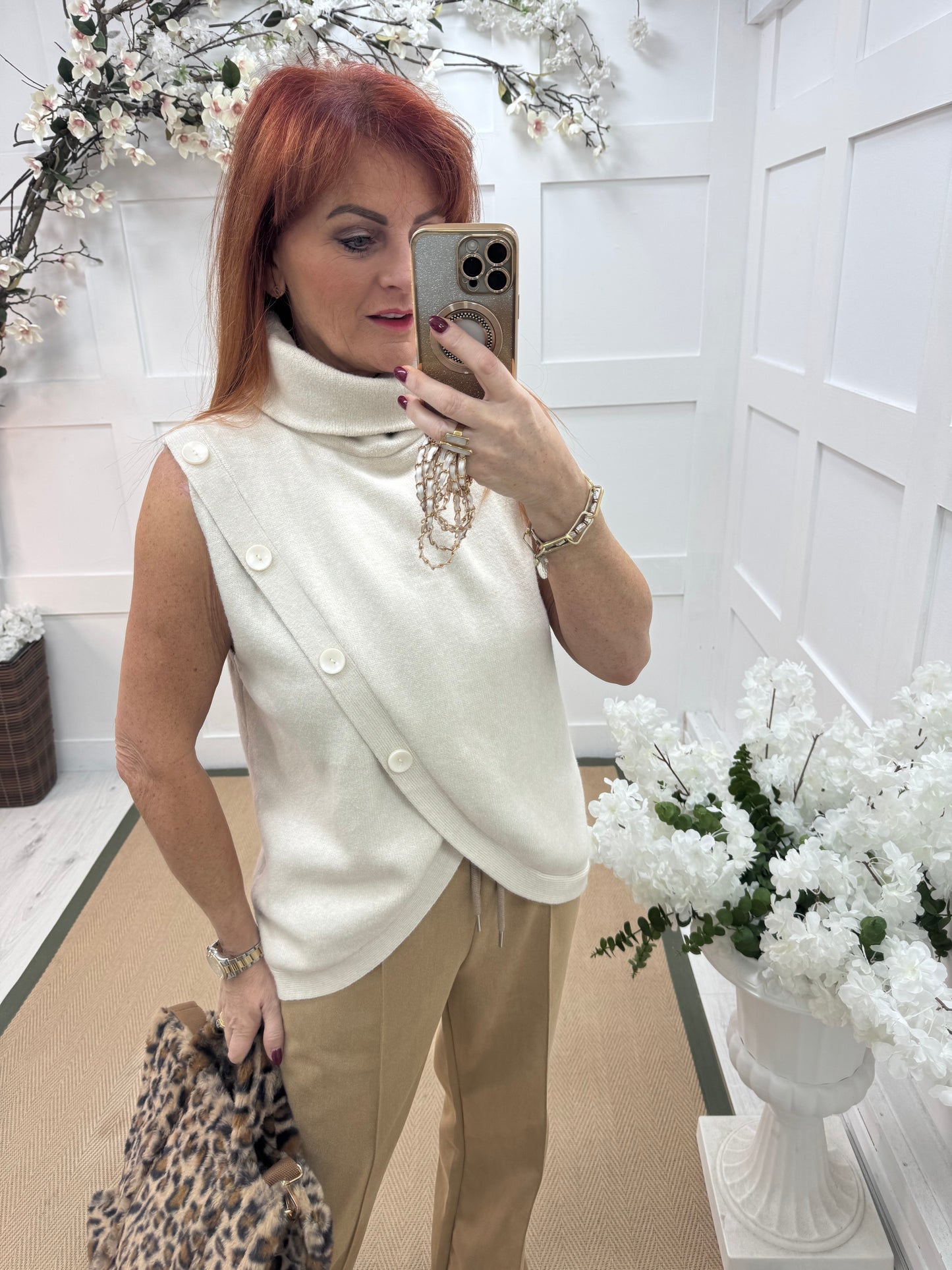 Viola: Cream sleeveless cowl neck wrap top. One Sz: 10-16