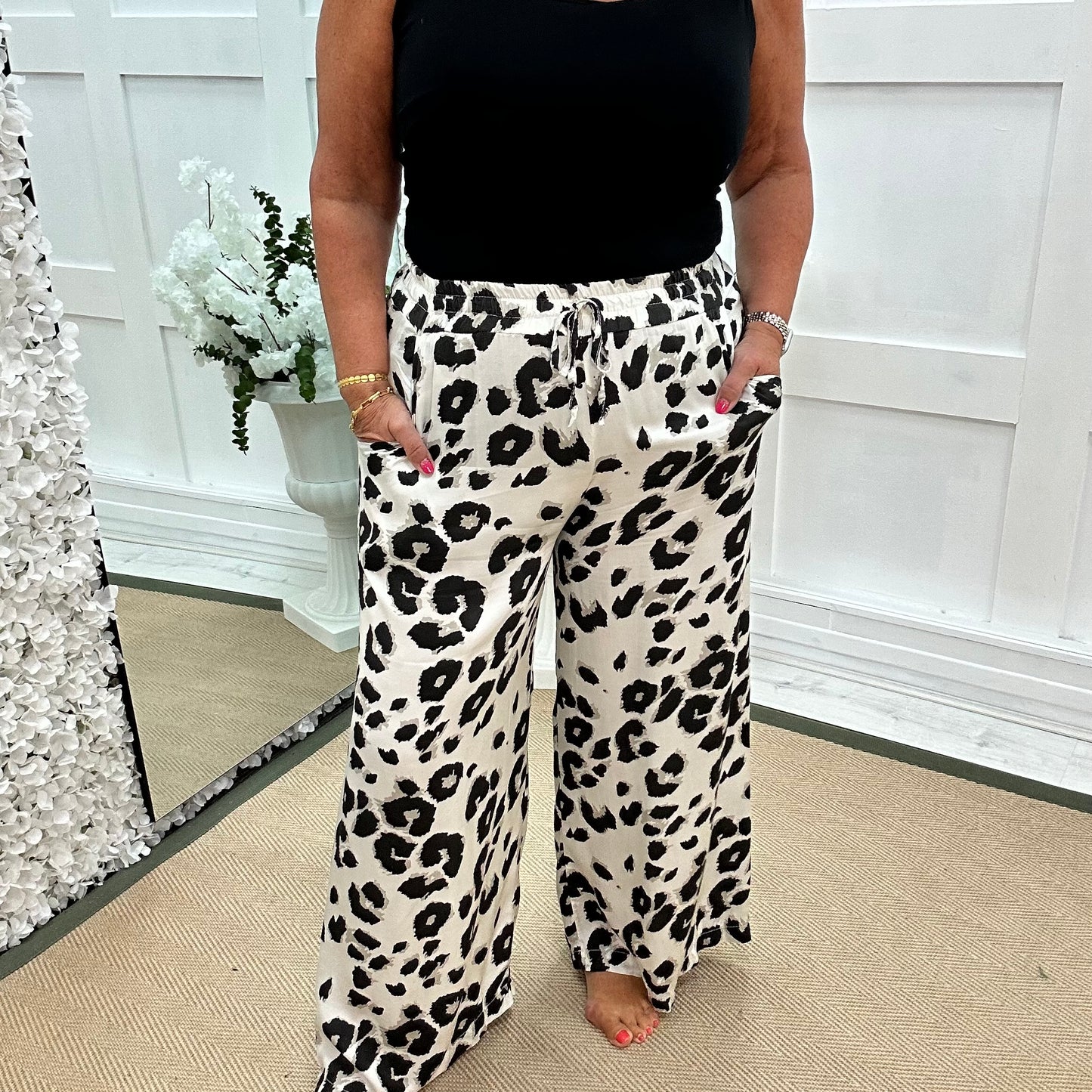 Dakota: White leopard print wide leg silky trousers. One size: 10-18