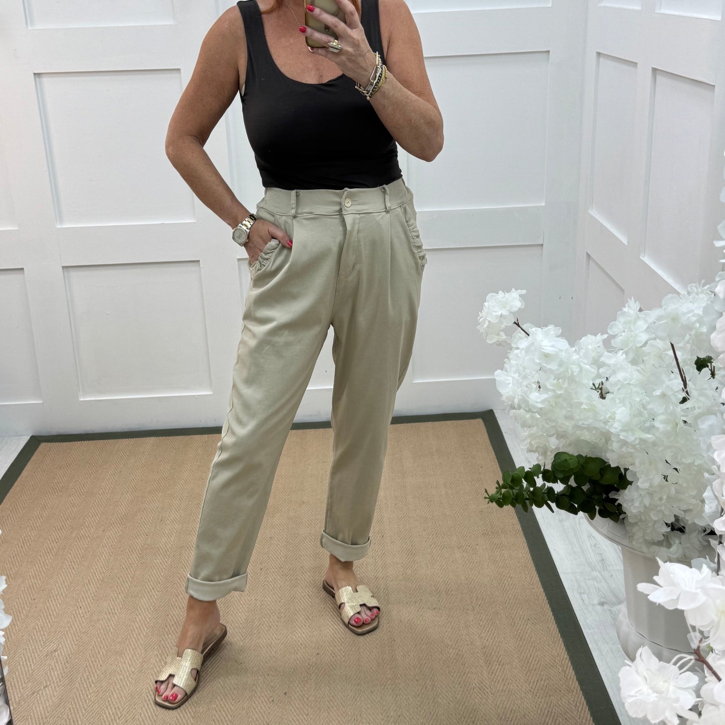Mandi: Cream stretchy frill pocket magic trousers with rear pockets. One Size: 14-20