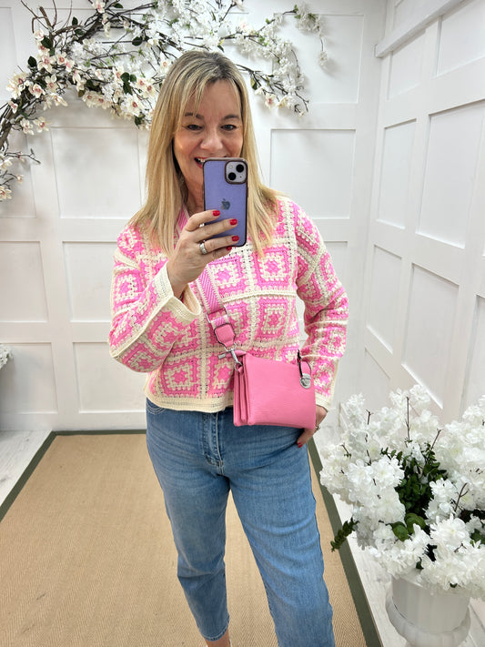 Britt: Candy pink three pocket crossbody bag.