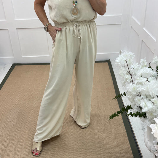 Esme: Cream pocket wide leg trousers. One size: 12-20