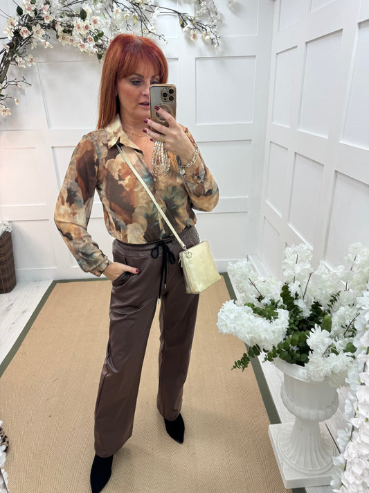 Rosario: Brown floral mesh shirt. One Sz: 10-16