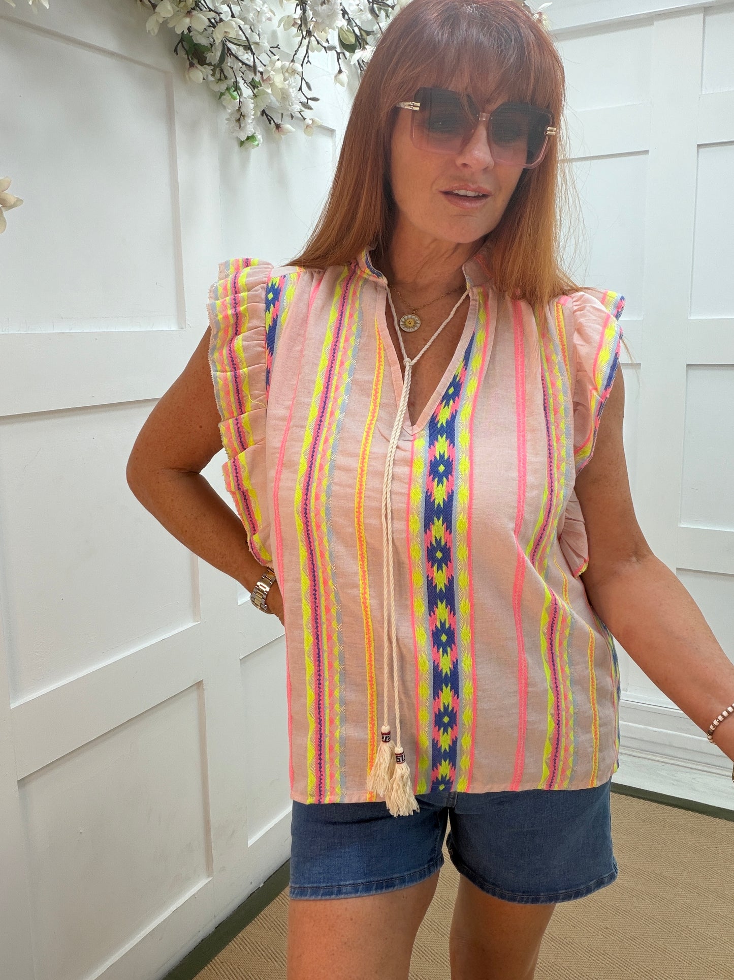 Alana: Aztec printed V neck tassel top. One size: 12-16. 2 colours