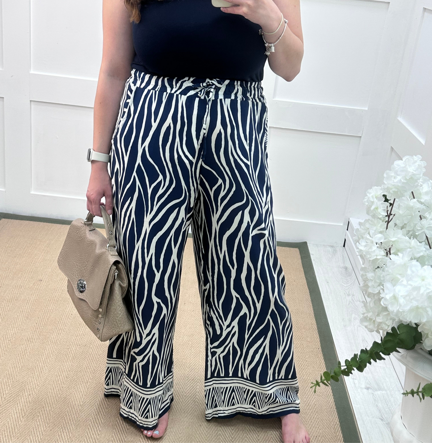 Skye: Navy zebra print wide leg trousers. One size: 10-16