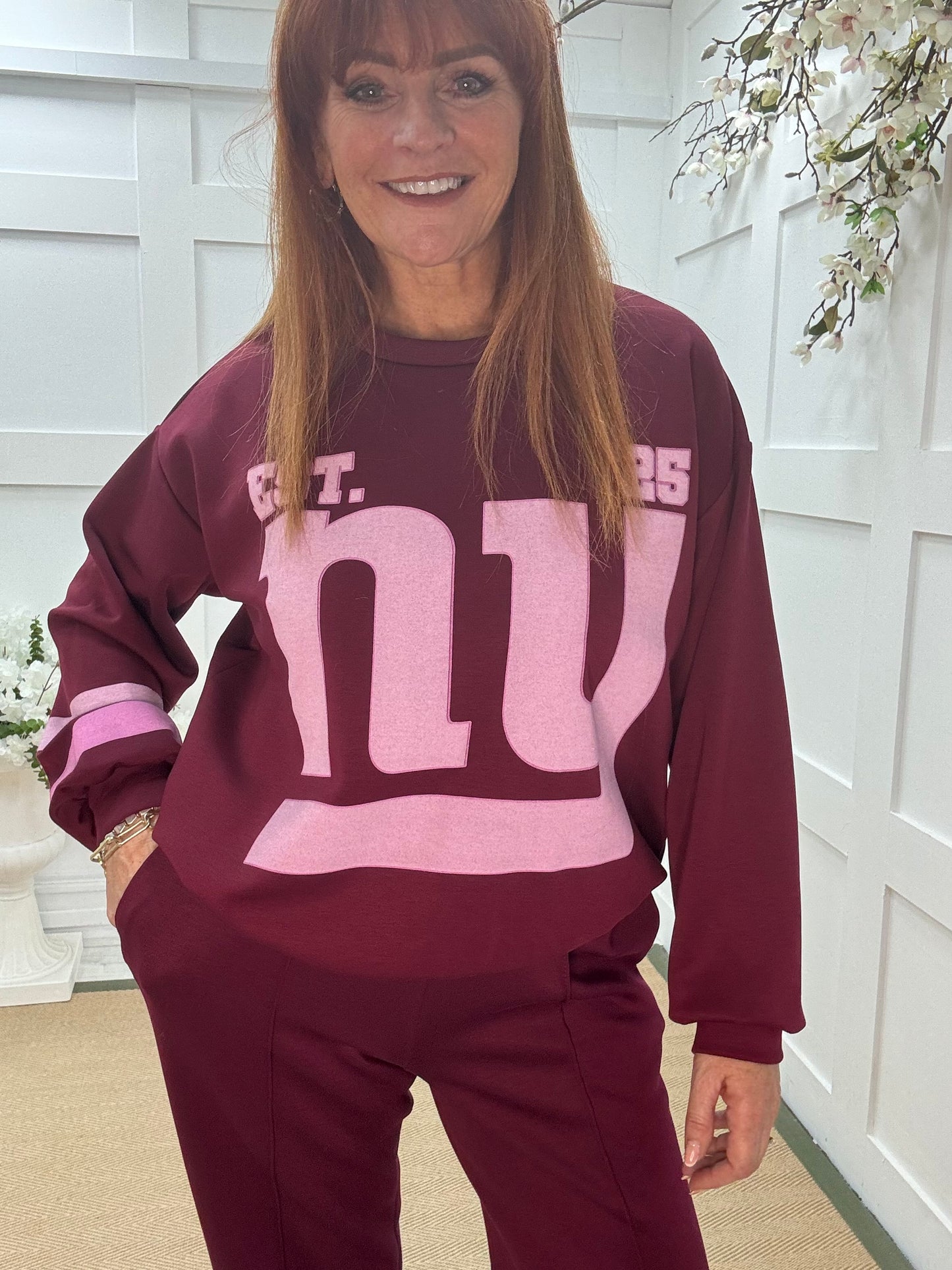 Liberty: Burgundy New York long sleeve top. One size: 12-18