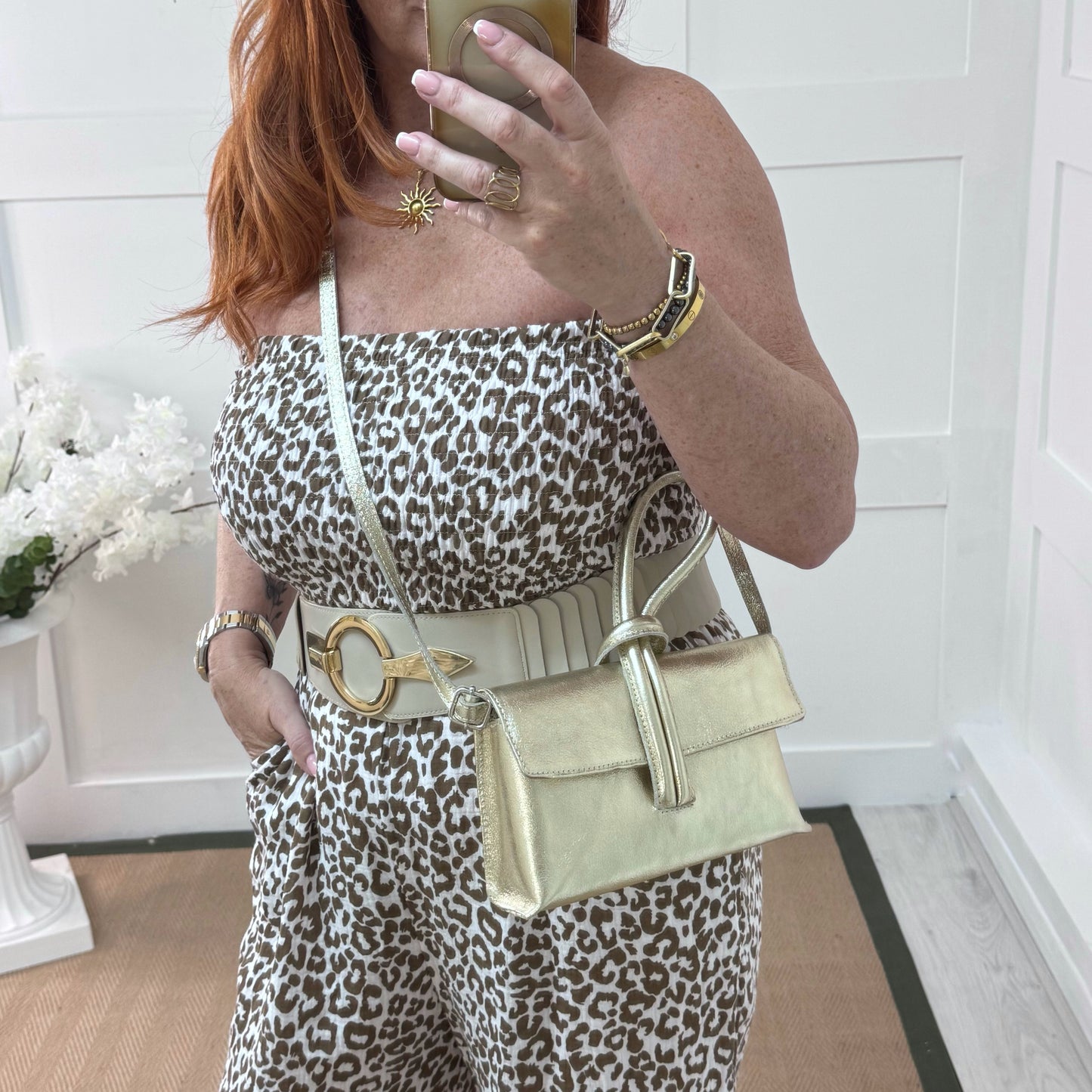 Alexis: Gold leather loop handle cross body/clutch bag.