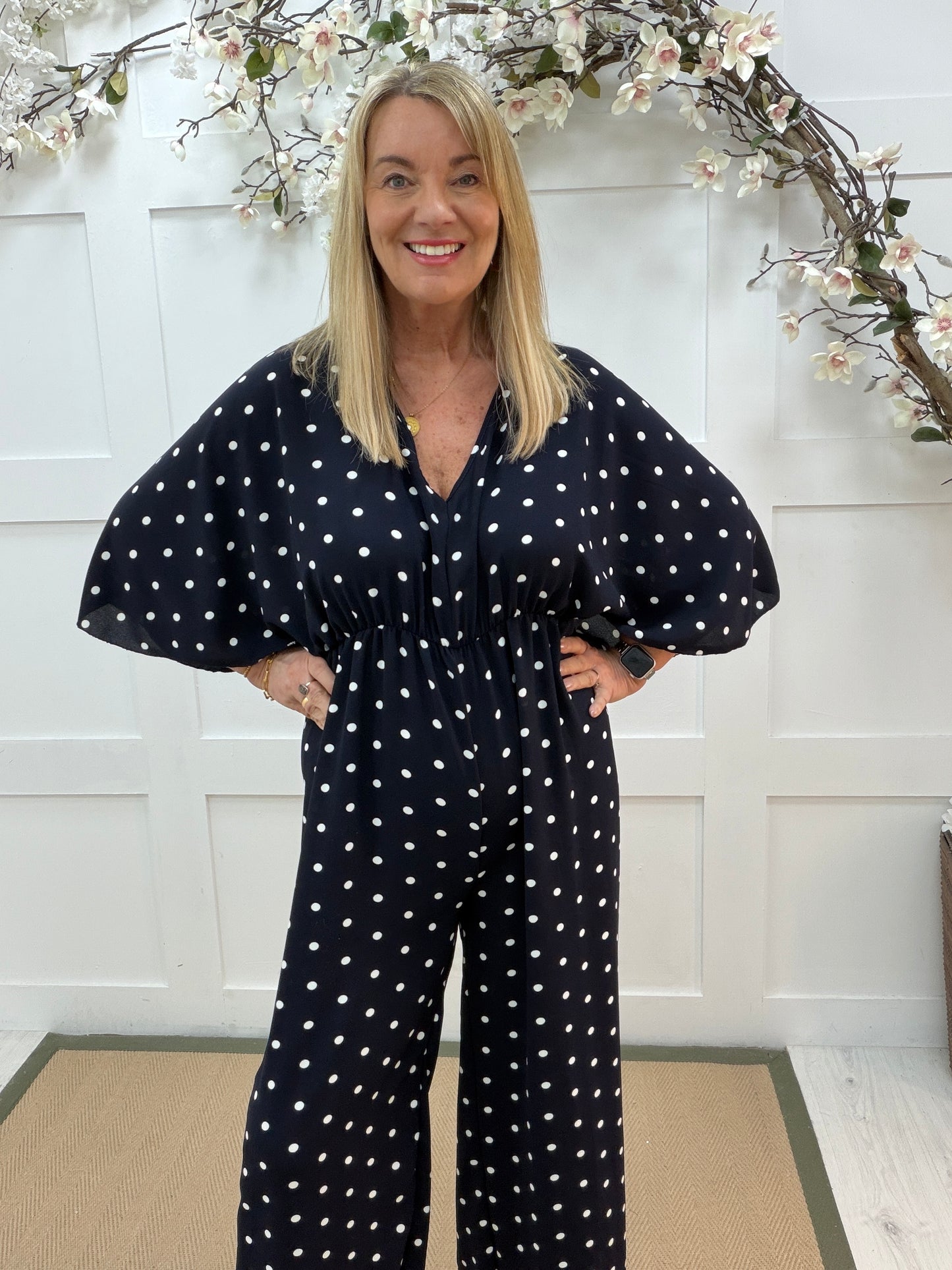 Amalia: Navy and white spotty wide leg jumpsuit. One size: 14-18