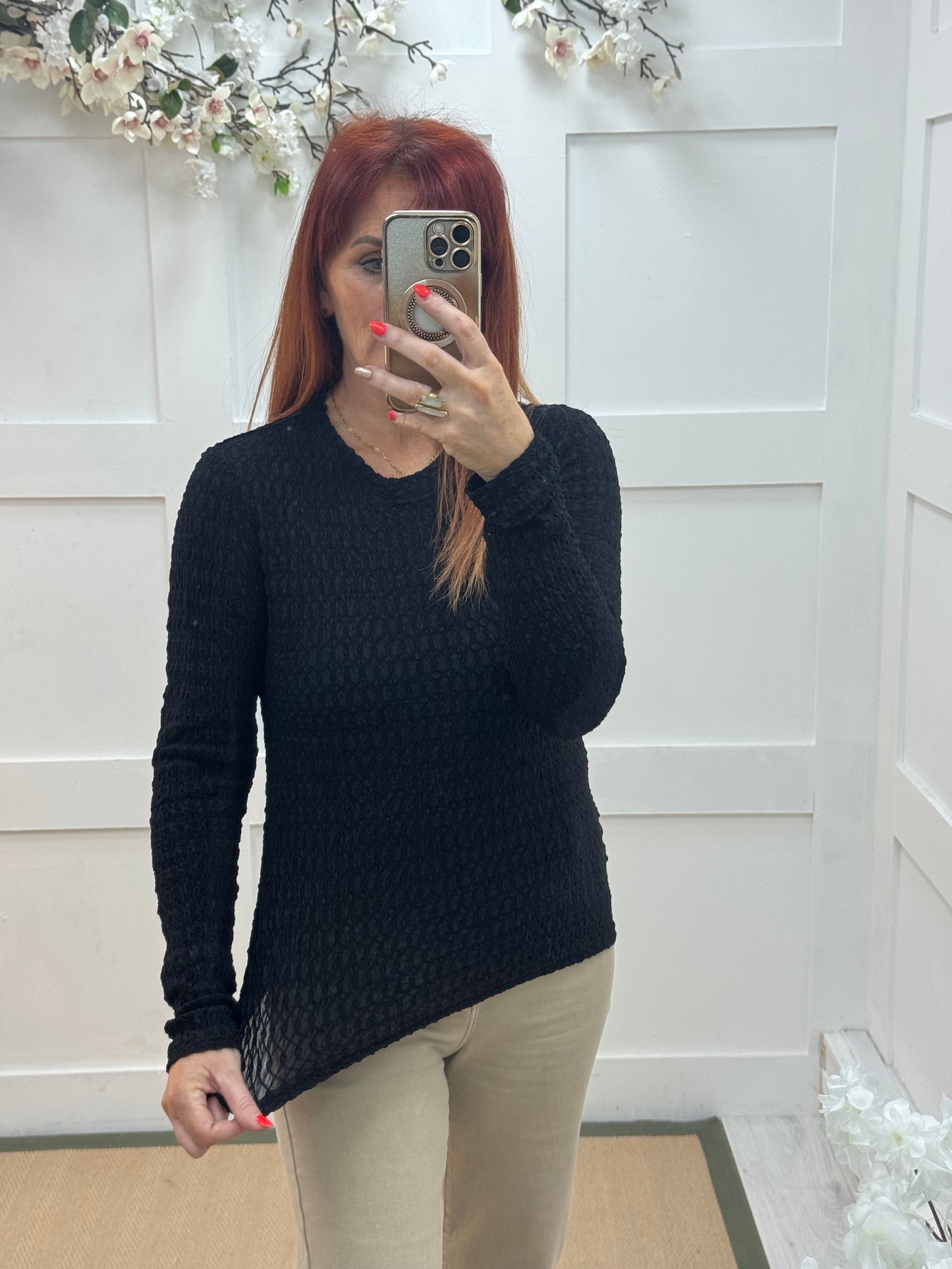 Lois: Black stretchy textured long sleeve top. One size: 12-20