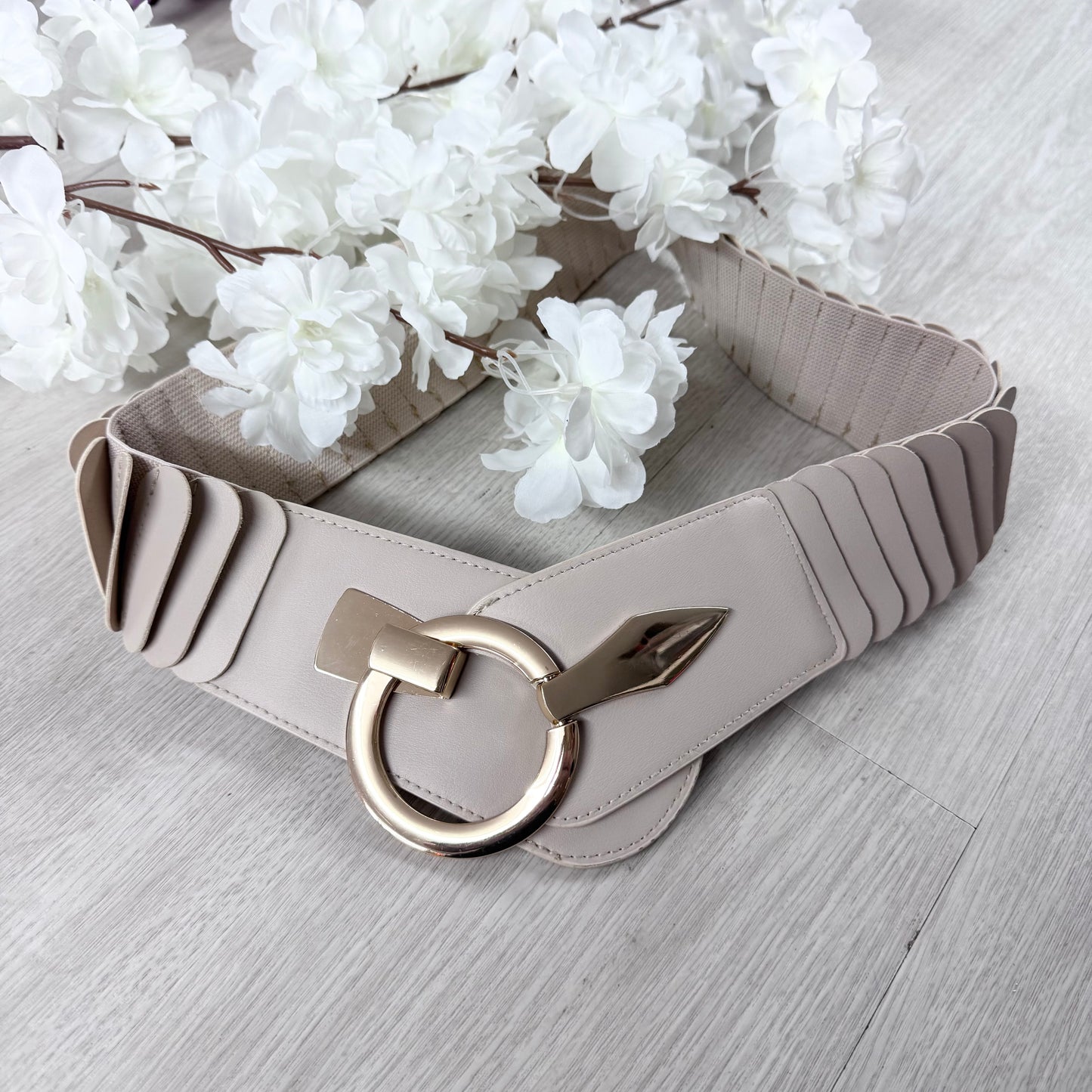 Rina: Stretchy belt with large buckle. One Size 10-18