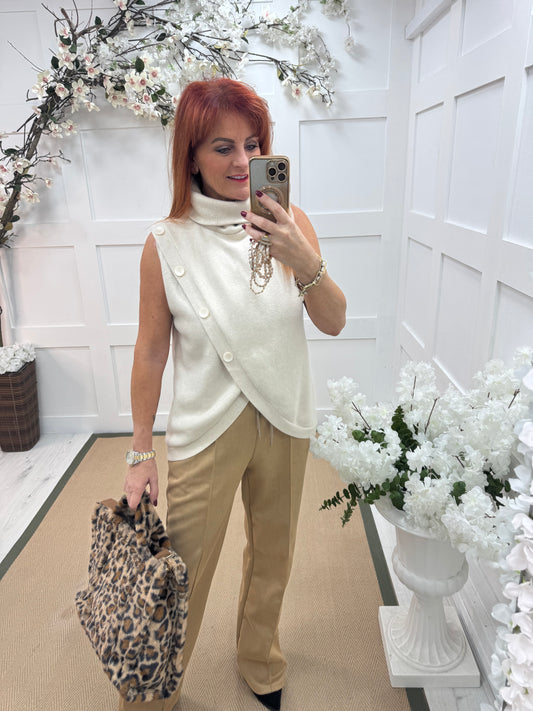 Viola: Cream sleeveless cowl neck wrap top. One Sz: 10-16