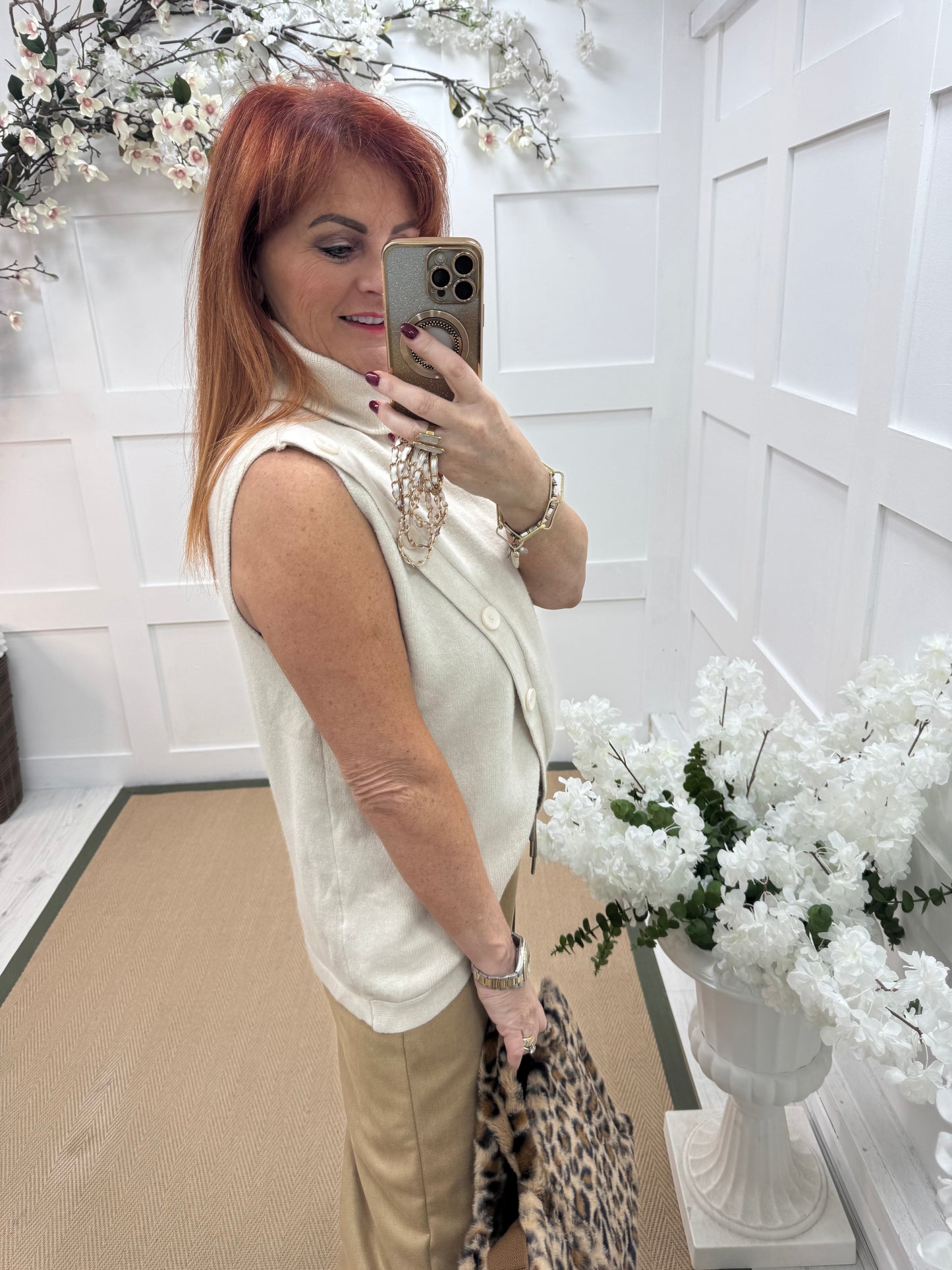 Viola: Cream sleeveless cowl neck wrap top. One Sz: 10-16