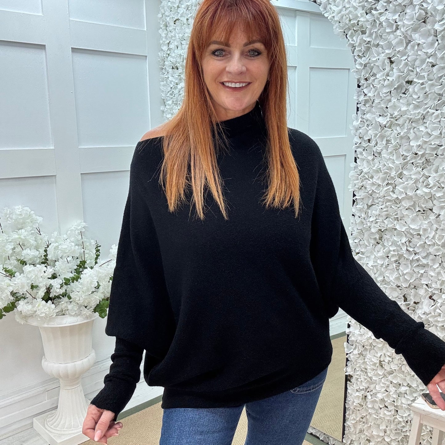 Erica: Black asymmetrical slouch soft knit top. One size 10-18