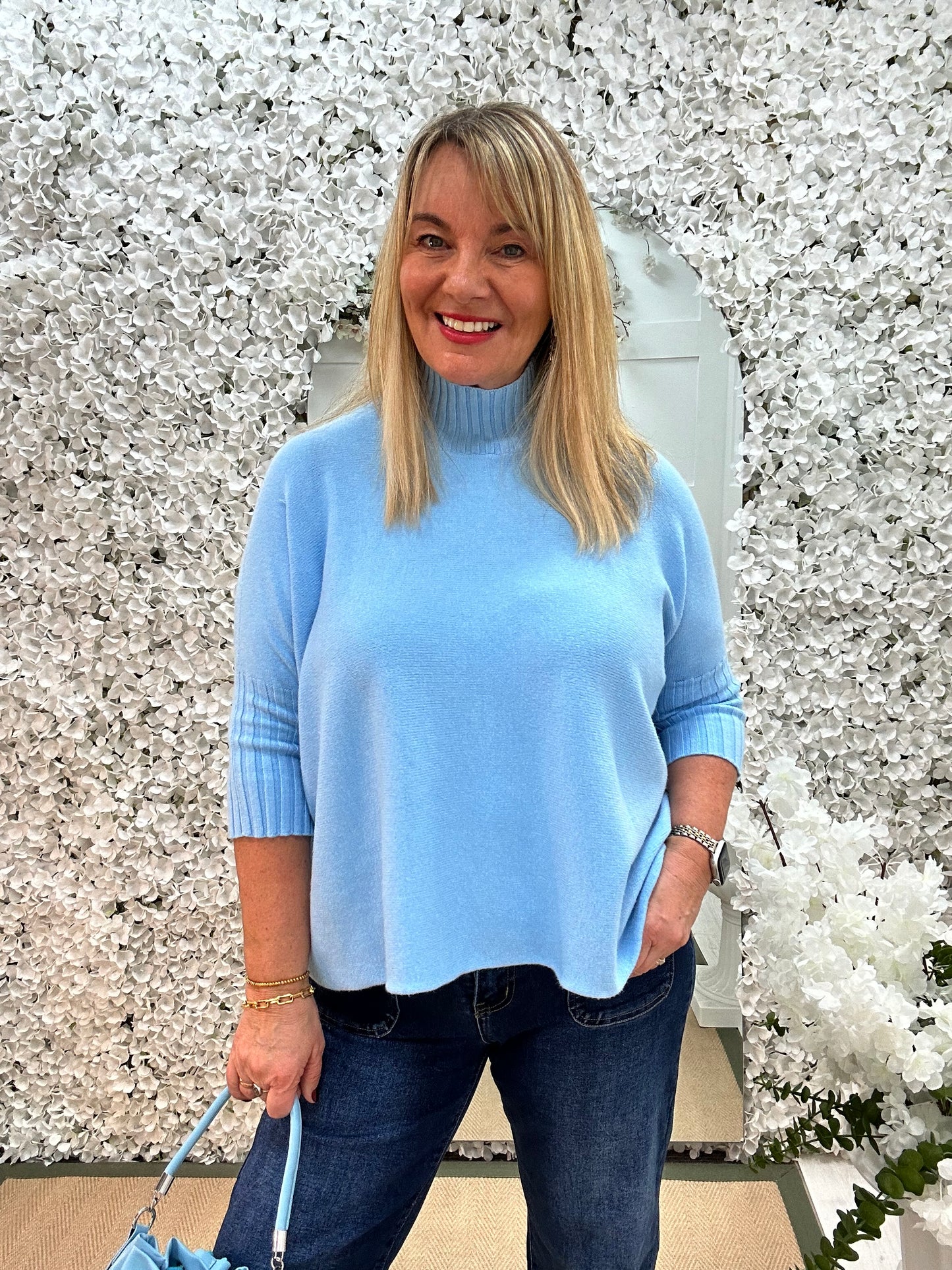 Sammie: Blue high neck knitted top. One Sz: 12-18