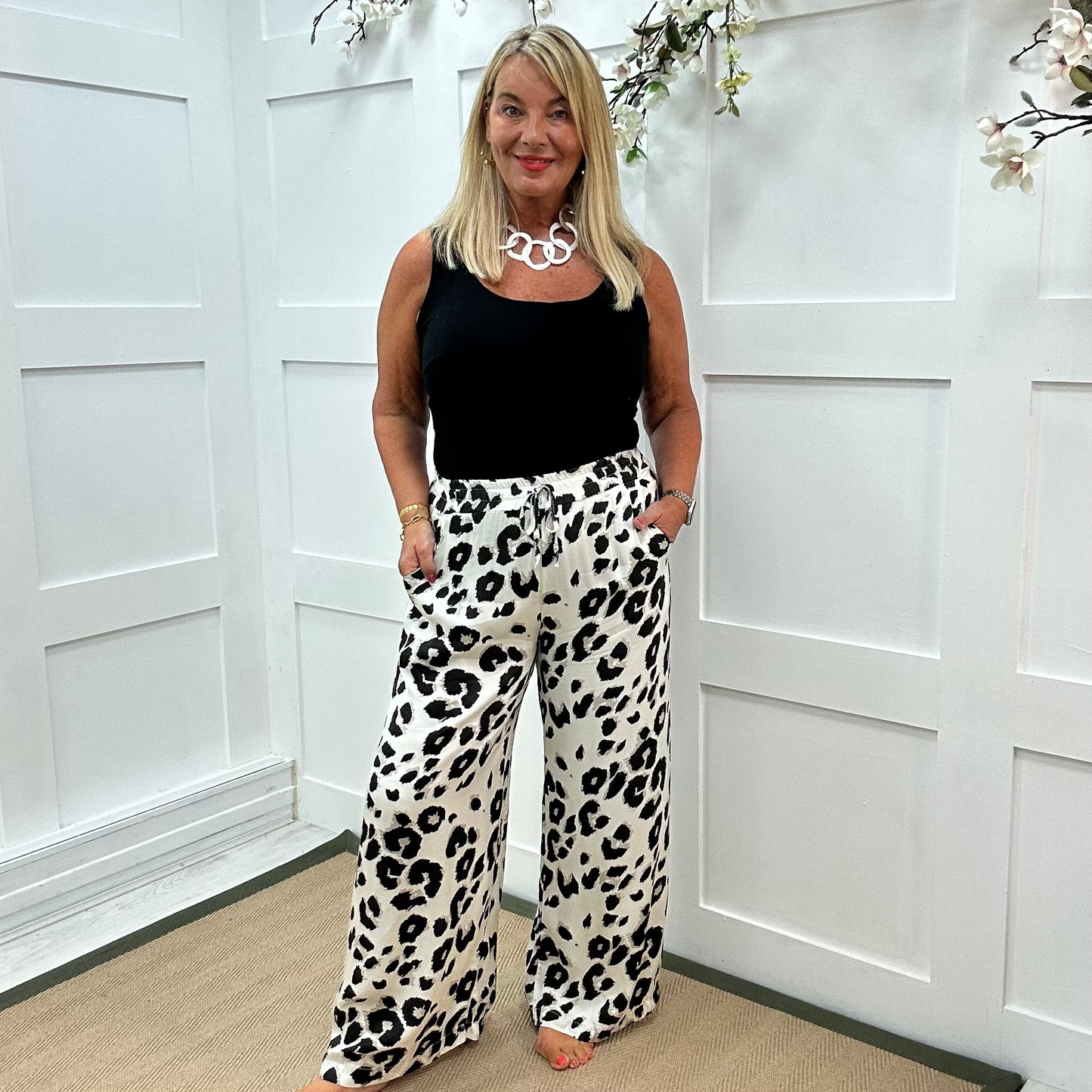 Dakota: White leopard print wide leg silky trousers. One size: 10-18