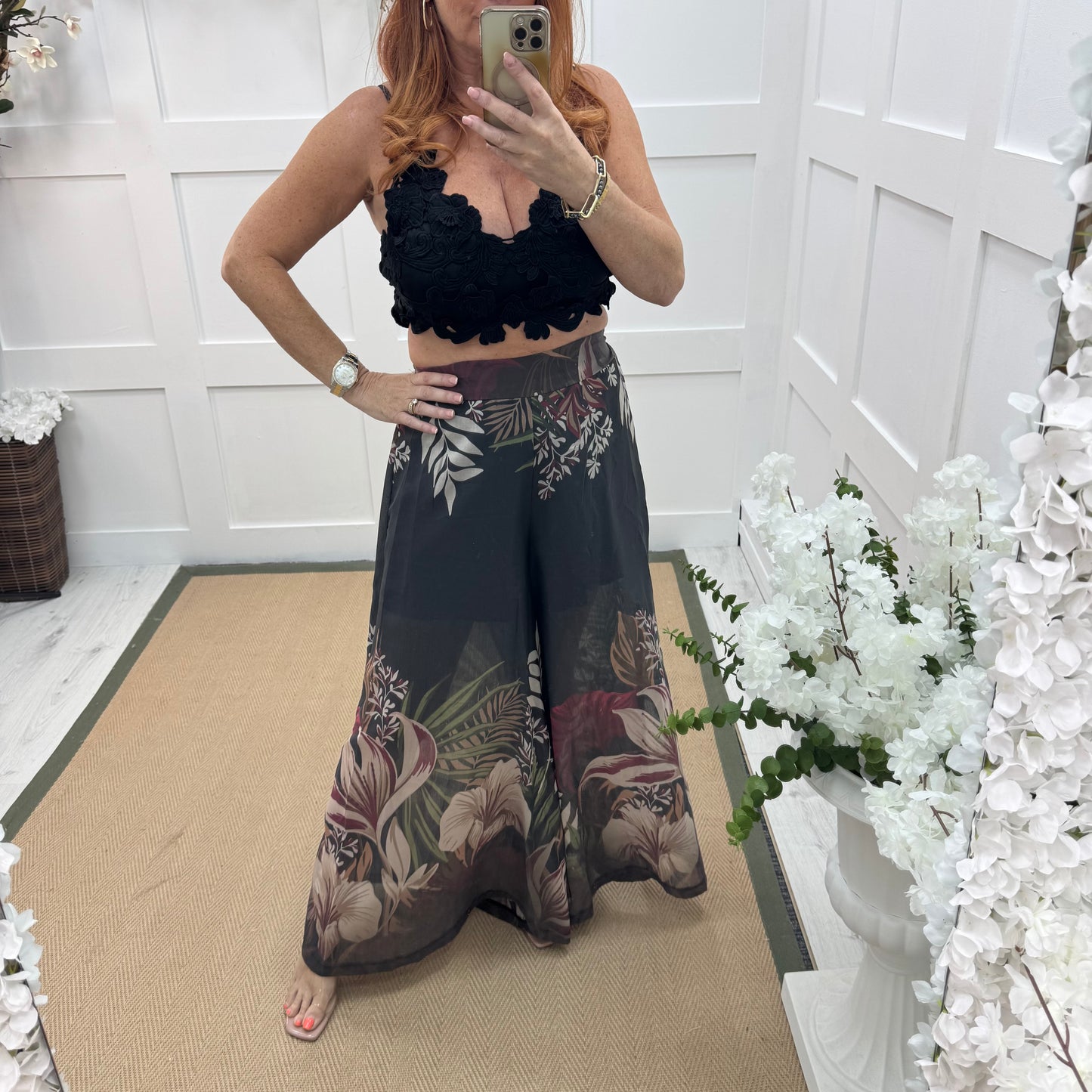 Lyra: Black tropical print wide leg sheer trousers. One size: 8-14