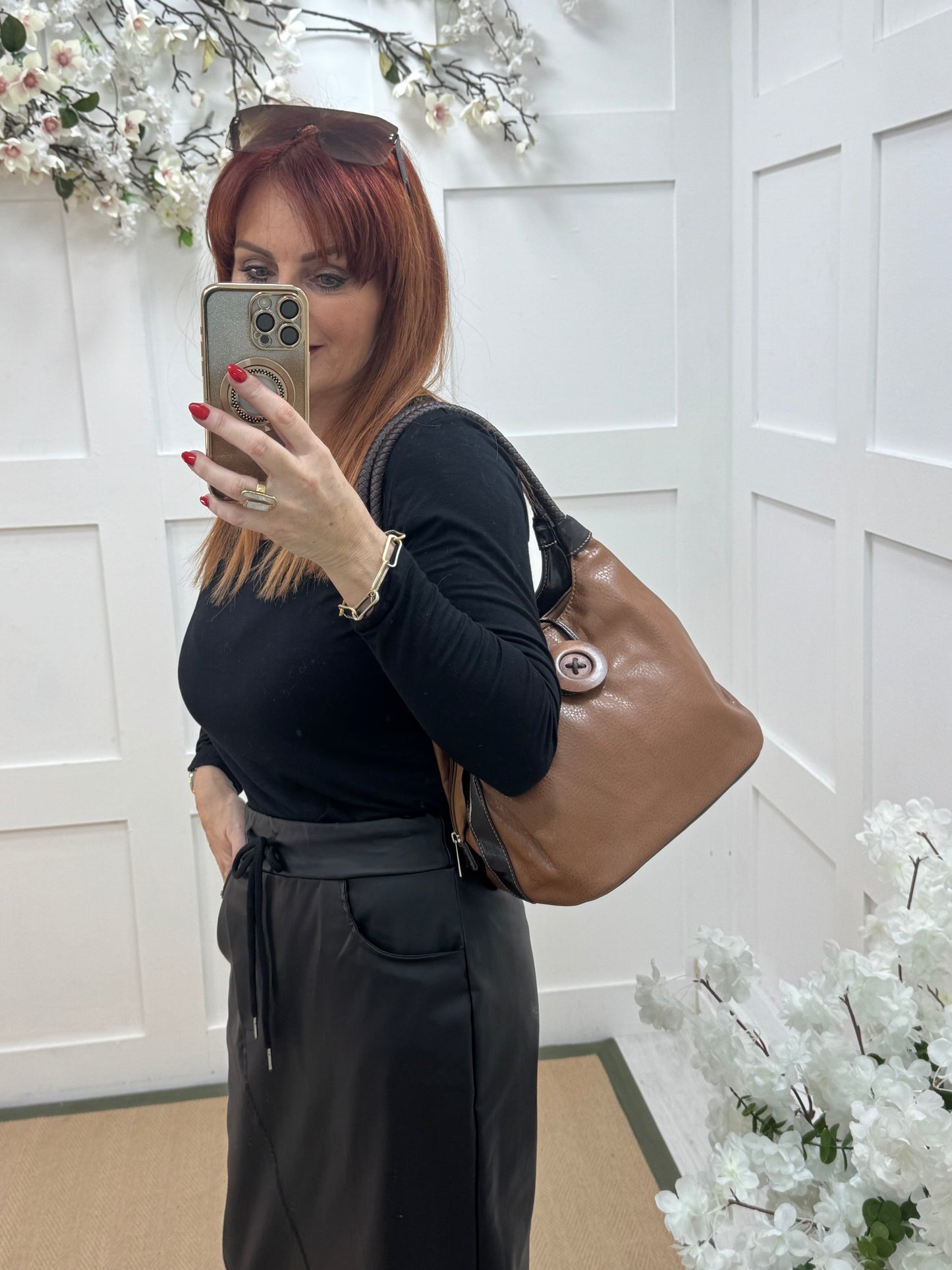 Pipa: Brown slouchy big button shoulder bag.