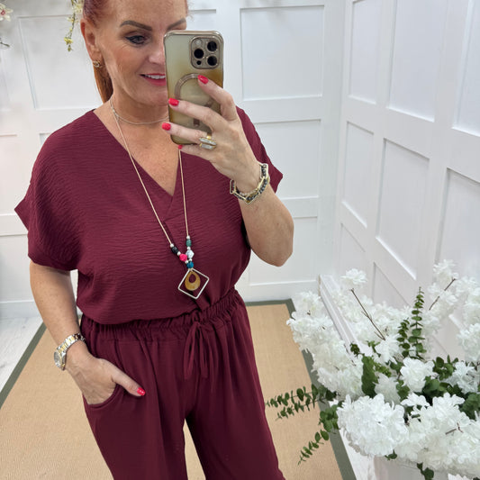 Eliza: Burgundy V neck top & pendant. One size: 14-20