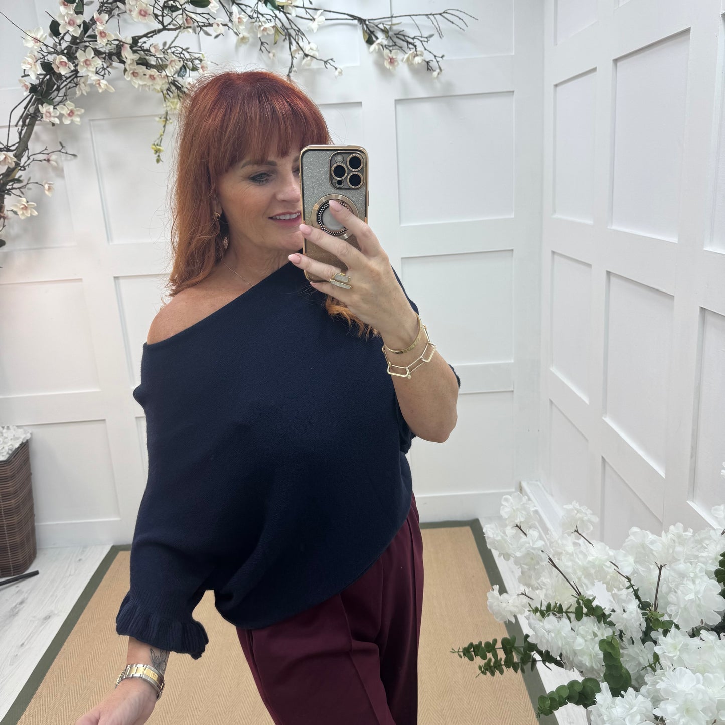 Sierra: Navy batwing fluted sleeve knitted top. One Size 12-18/20