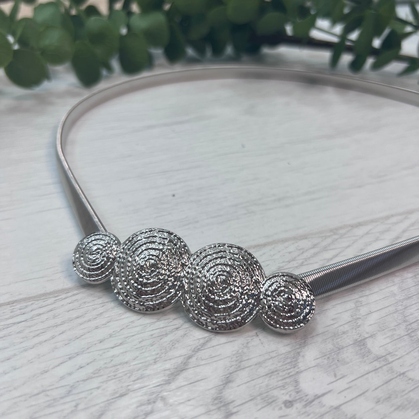 Mo: Silver metal sphere statement belt. One size: 8-18