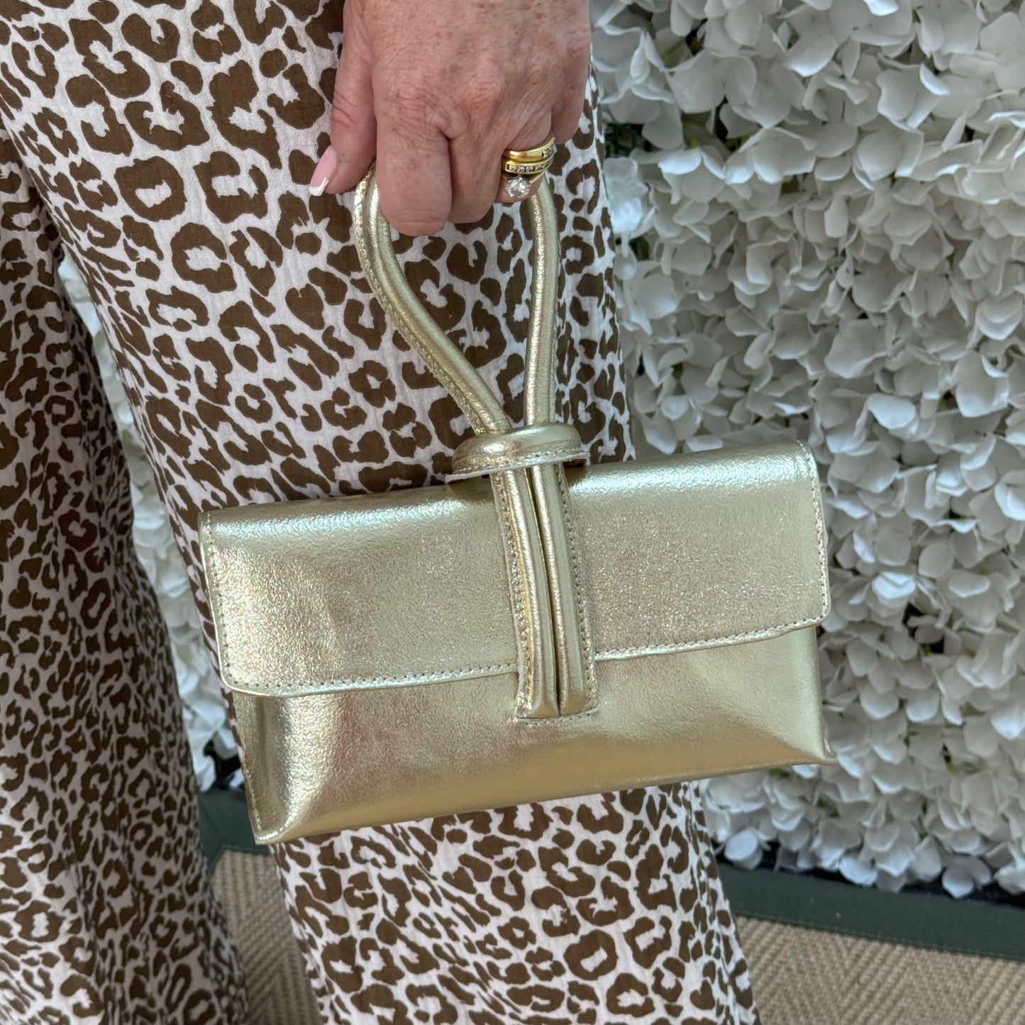 Alexis: Gold leather loop handle cross body/clutch bag.