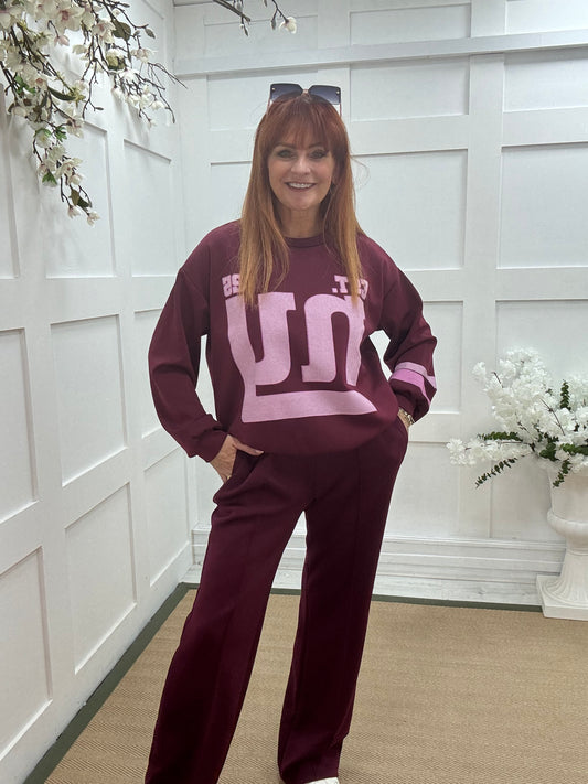 Liberty: Burgundy New York long sleeve top. One size: 12-18