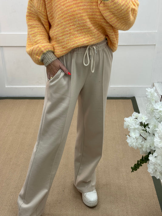 Trudy: Cream stretchy wide leg pocket trousers. 2 sizes