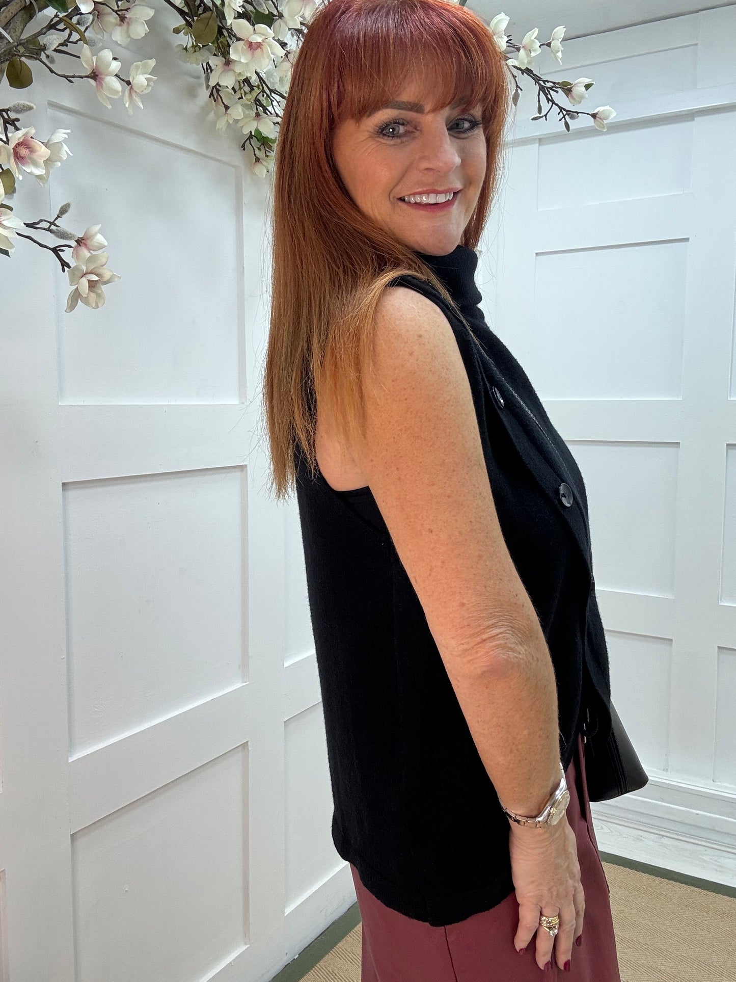 Viola: Black sleeveless cowl neck wrap top. One Sz: 10-16