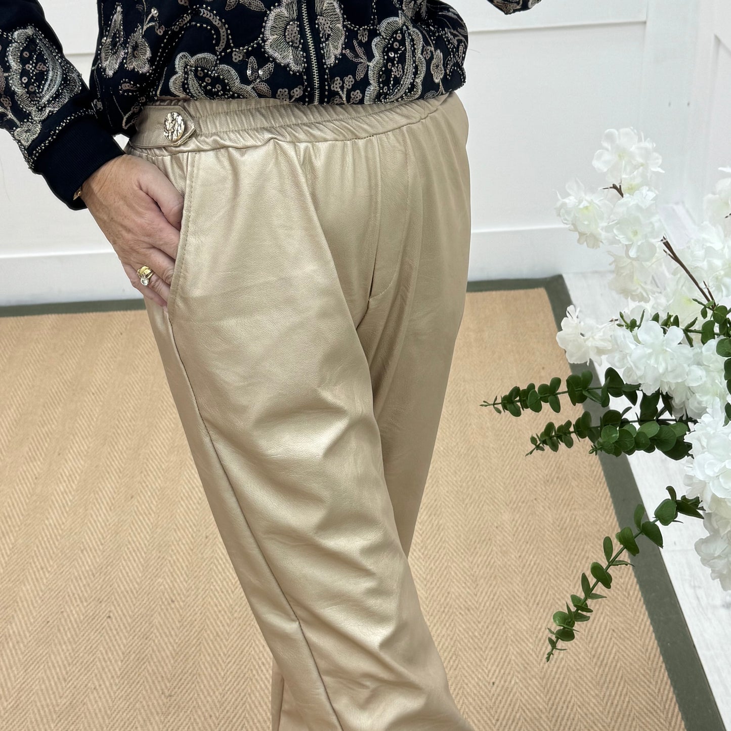 Tatum: Gold faux leather button trousers. One size: 14-18
