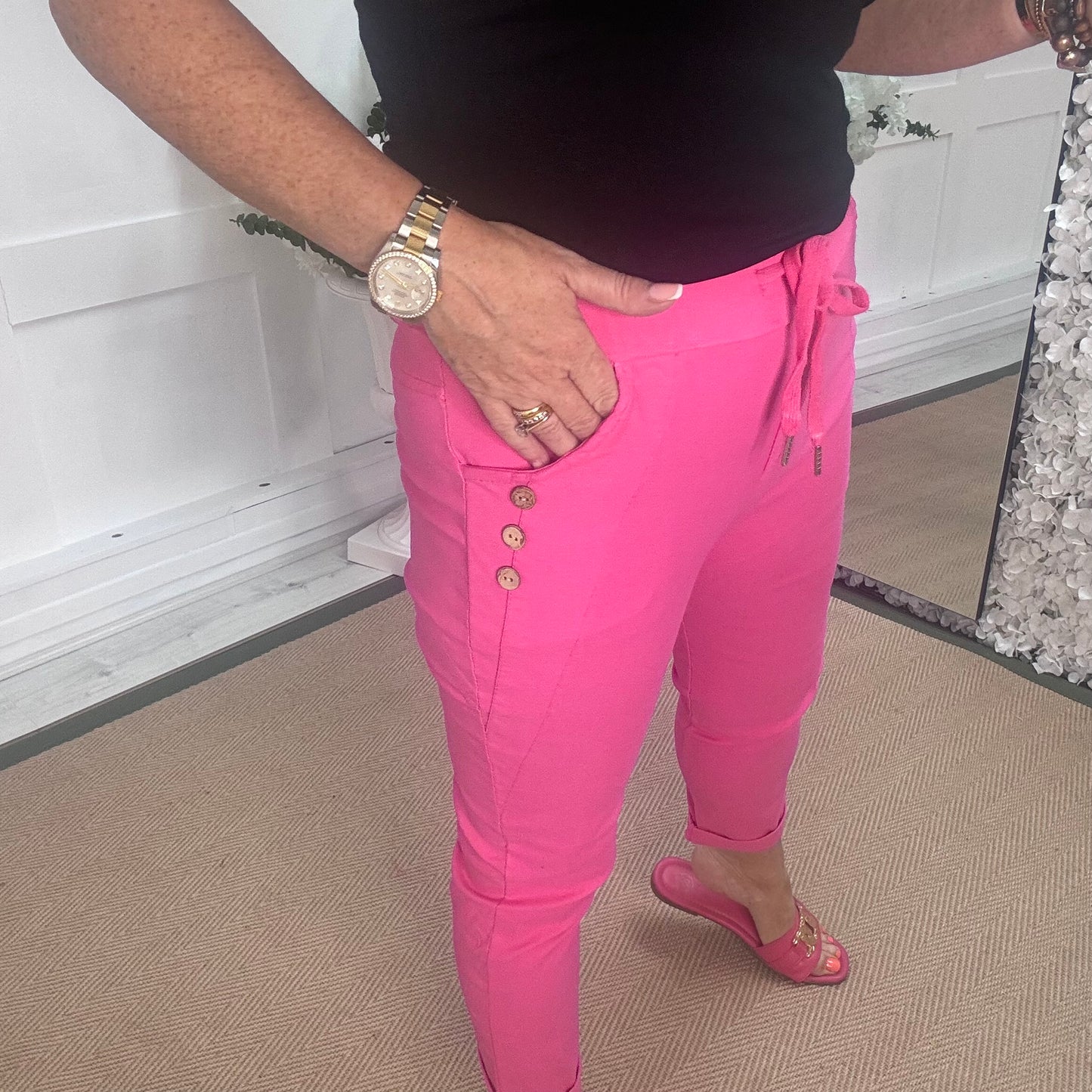 Betsy: Stretchy hot pink button magic trousers. One size: 10-14