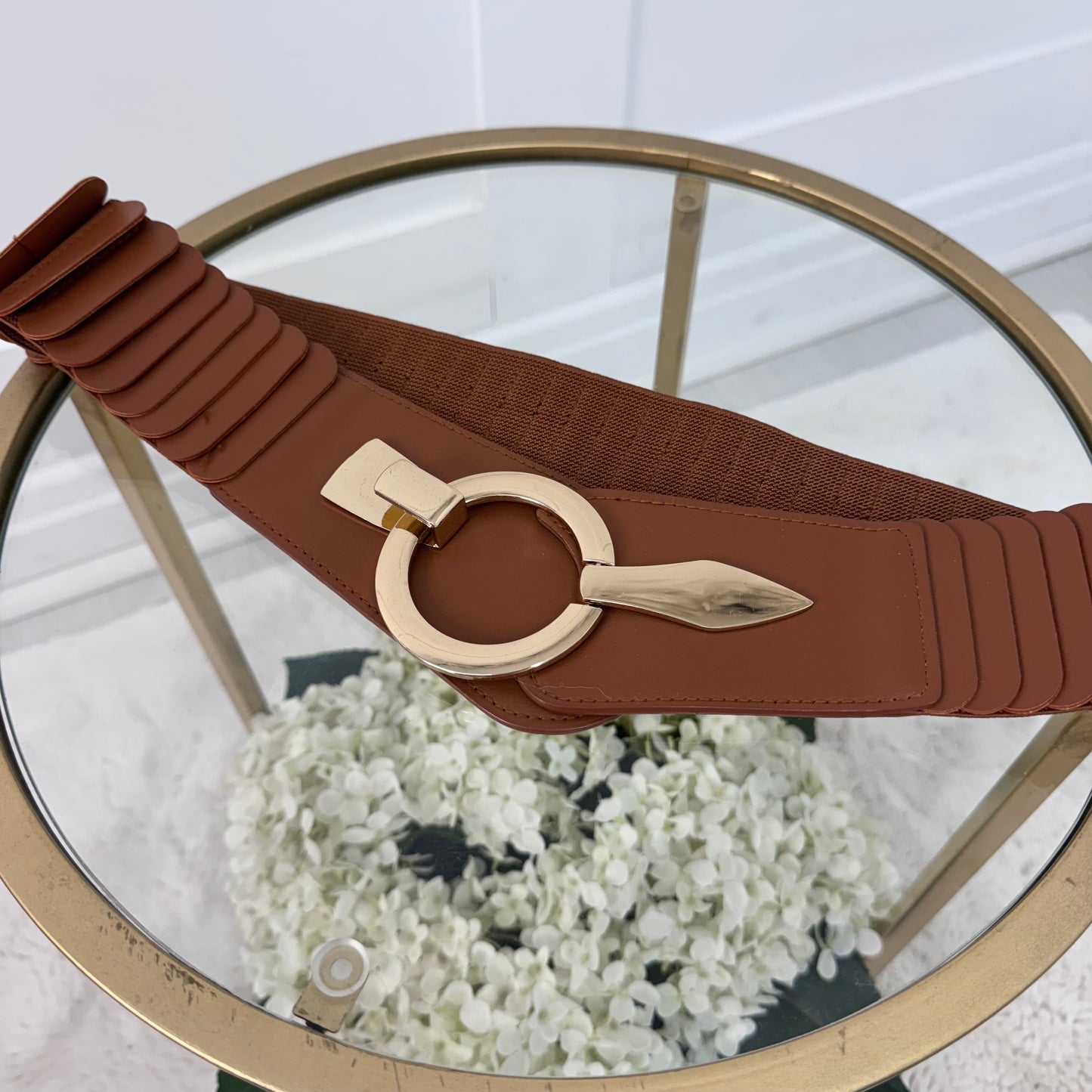 Rina: Stretchy belt with large buckle. One Size 10-18
