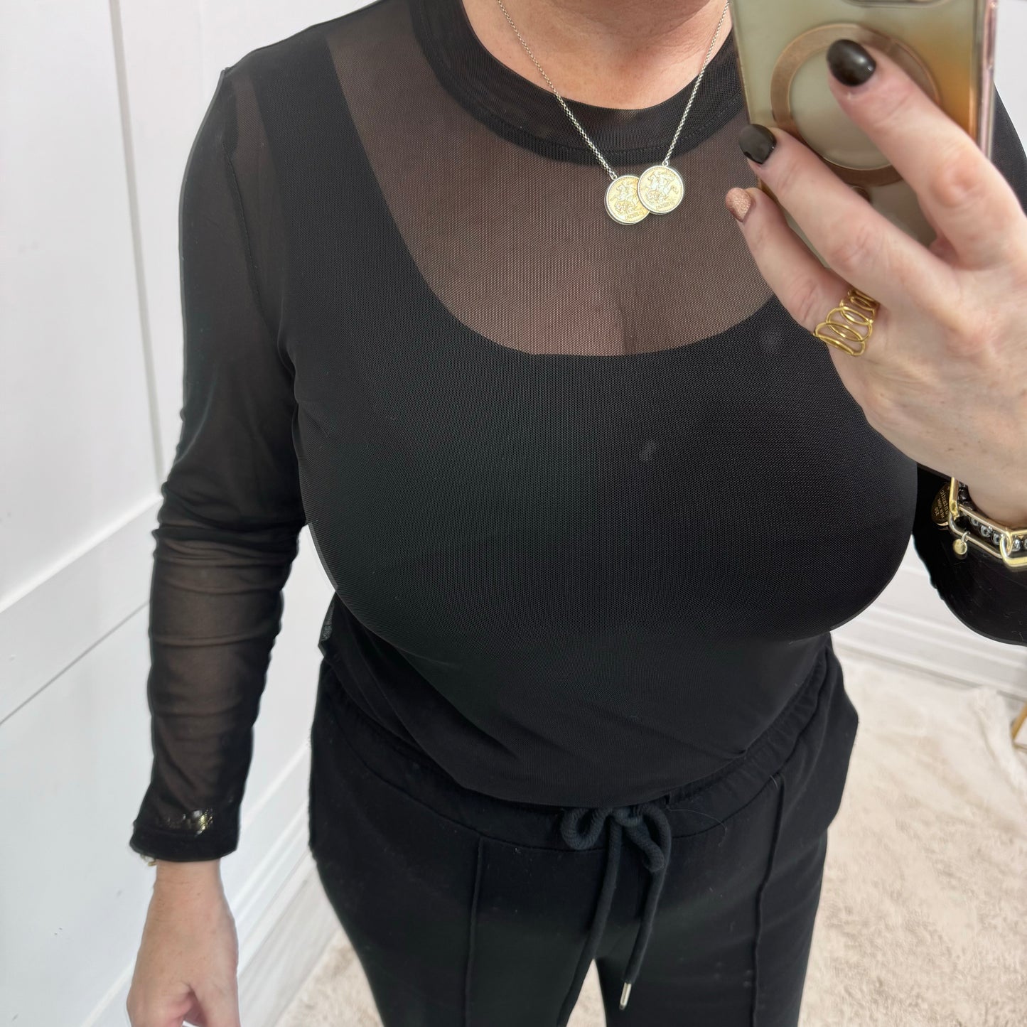 Romy: Black stretchy sheer mesh top. One size 12-18