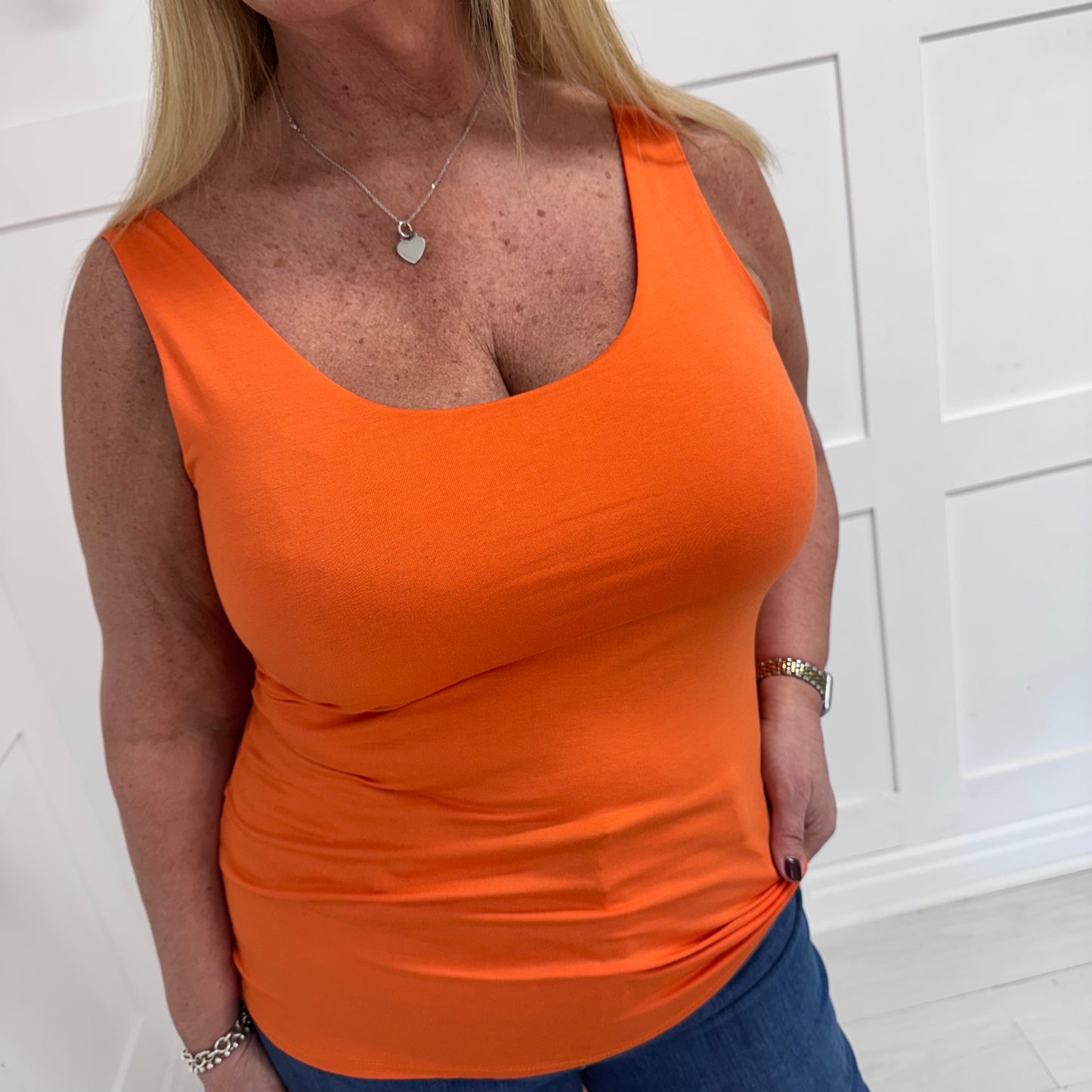 Abigail: Stretchy basic orange vest top. 2 sizes