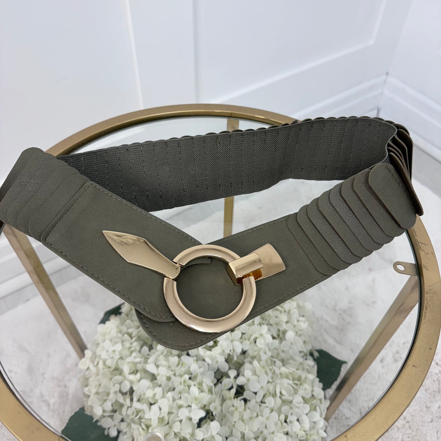 Rina: Stretchy belt with large buckle. One Size 10-18