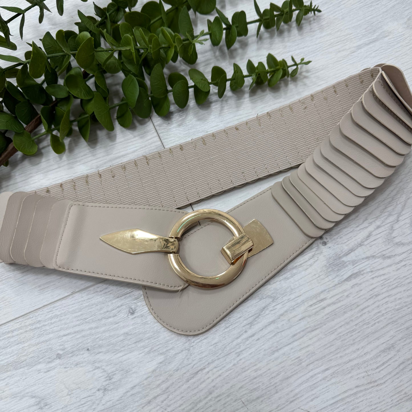 Rina: Stretchy belt with large buckle. One Size 10-18