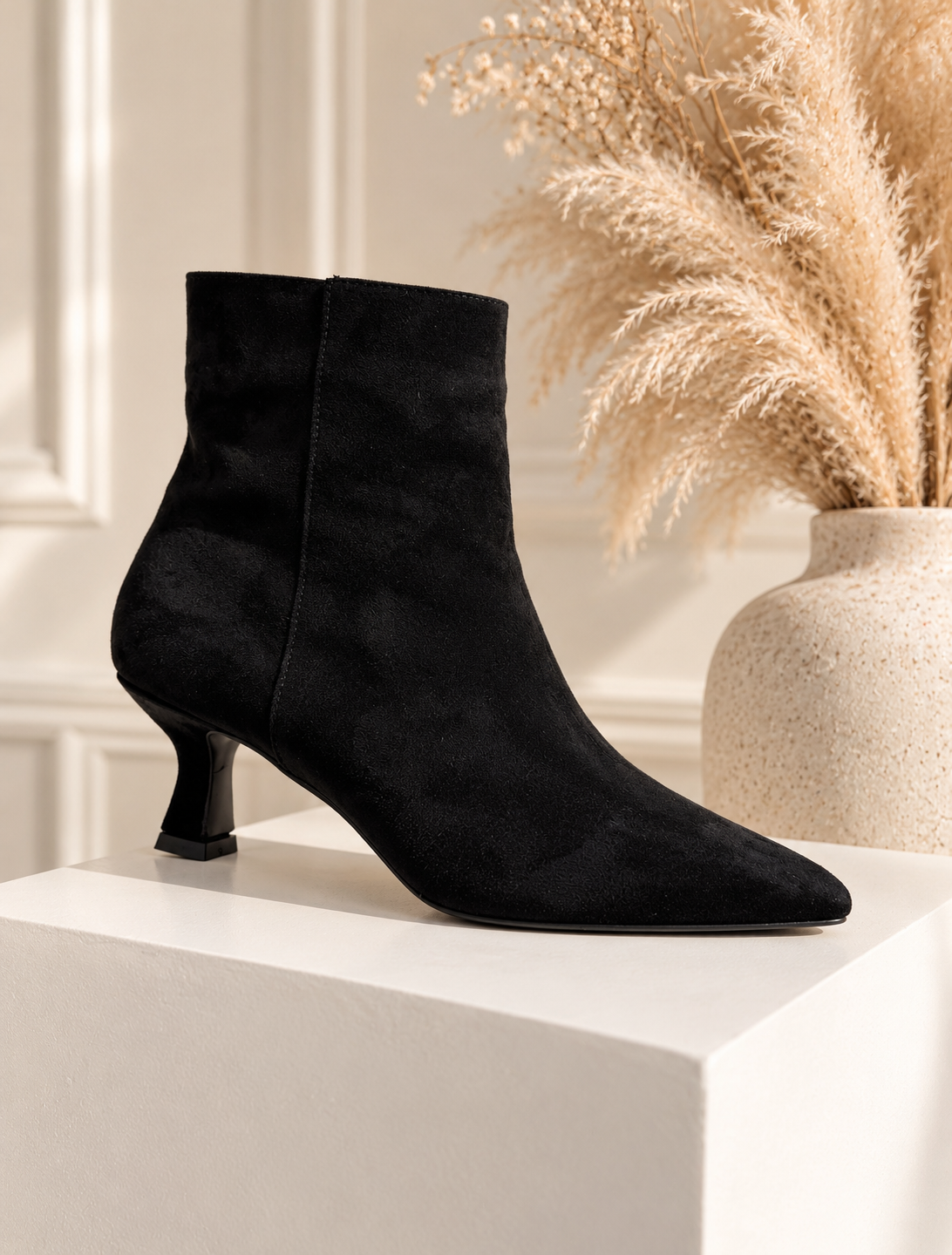 Zola: Black pointed ankle boots. Sizes: 3-8